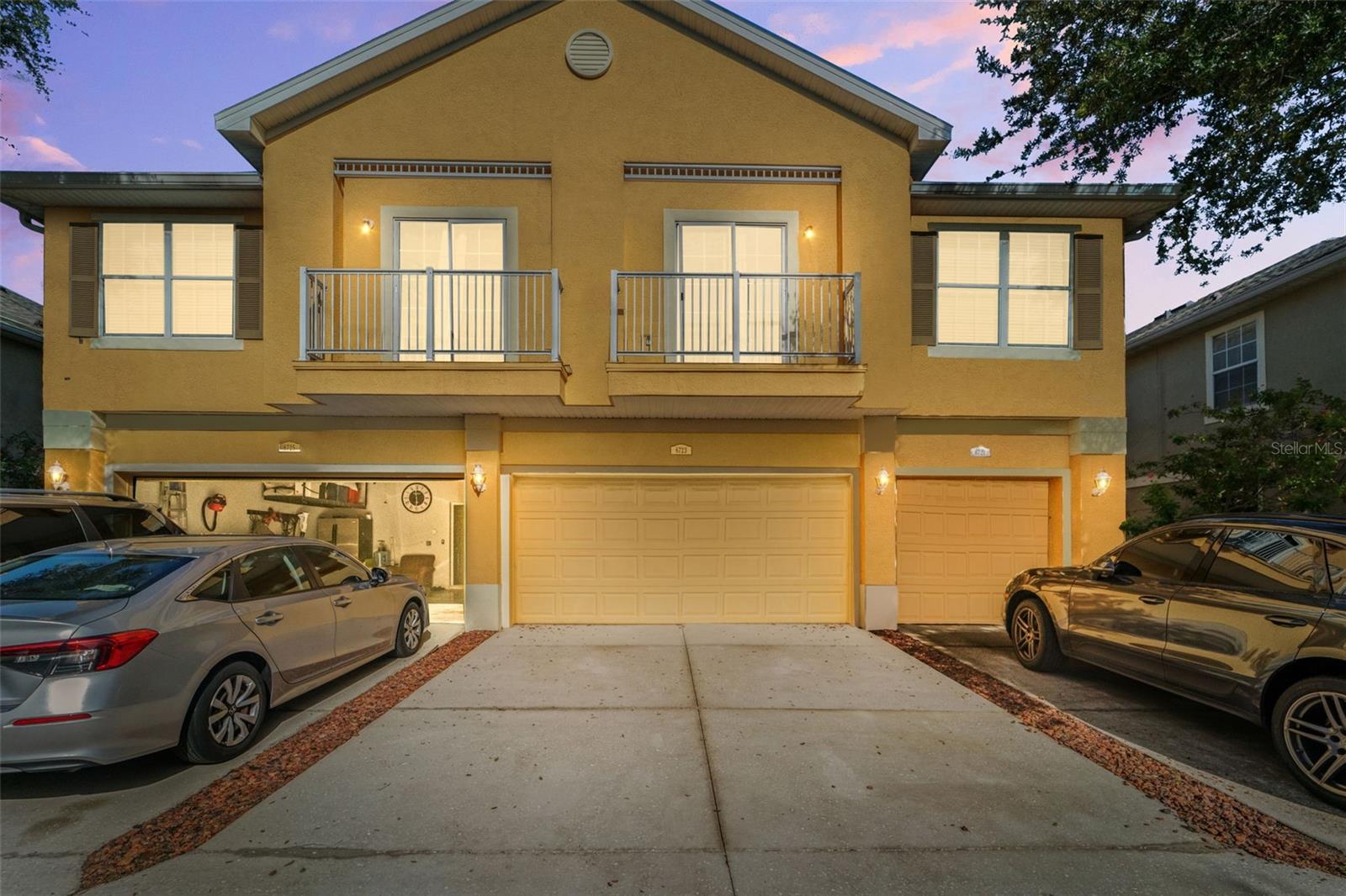 Welcome to this beautifully maintained 3-bedroom, 2.5-bathroom townhome located in the gated, picturesque, family friendly Eagle Palm community! This gorgeous two-story home includes over 1,600 square feet of living space with modern touches throughout. The open-concept first floor layout includes a living/dining room combo, well-appointed kitchen with modern stainless steel appliances including refrigerator, flat top stove, and dishwasher. An abundance of natural light streams in through numerous large windows providing a bright and inviting space. The first floor also includes a half-bath with a pedestal sink, a laundry room with full sized washer and dryer, and the entryway to the spacious 2 car garage. Ascending the stairs, you will find the three bedrooms and two full bathrooms. The second and third bedrooms include carpet, a ceiling fan, a window with custom curtains, and good-sized closet. The first full bath includes a shower/tub combo. The primary suite is a large with a spacious closet and has three over-sized windows that let in plenty of natural light. All non-carpeted areas have beautiful and durable laminate wood flooring. The home backs up to a wooded preserve area for extra privacy. Eagle Palm community amenities include a sparkling pool, a gate manned 24/7 by a remote security guard, and beautiful landscaping. Water, sewer, trash, landscaping, and common element maintenance and insurance are included in the community association dues. This quiet and peaceful neighborhood is conveniently located just minutes from the shopping districts and restaurants in Tampa and Brandon.