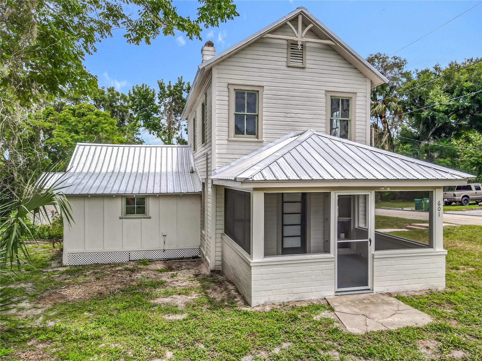 Step into timeless charm and modern luxuries in this beautifully restored historic home, ideally situated on a large corner lot close to vibrant Downtown DeLand. Thoughtfully updated to preserve its classic character, this residence offers the perfect blend of elegance and functionality. The main home showcases original architectural details alongside modern upgrades, including a renovated kitchen, electrical and plumbing upgrades, as well as stylish fixtures and touches throughout.
Tucked away across a blooming butterfly garden, the detached in-law suite offers privacy and comfort with its own full kitchen, spacious living area, and a full bathroom—ideal for guests, extended family, or rental income potential.
Enjoy mornings on the porch, afternoons in the garden oasis, and frequent easy visits to nearby shops, restaurants, and events. Located on a generously sized corner lot with mature landscaping and ample space to entertain, this property is a rare opportunity to own a piece of history near the heart of downtown and close to Stetson University.
Live where character meets convenience—schedule your private showing today!
