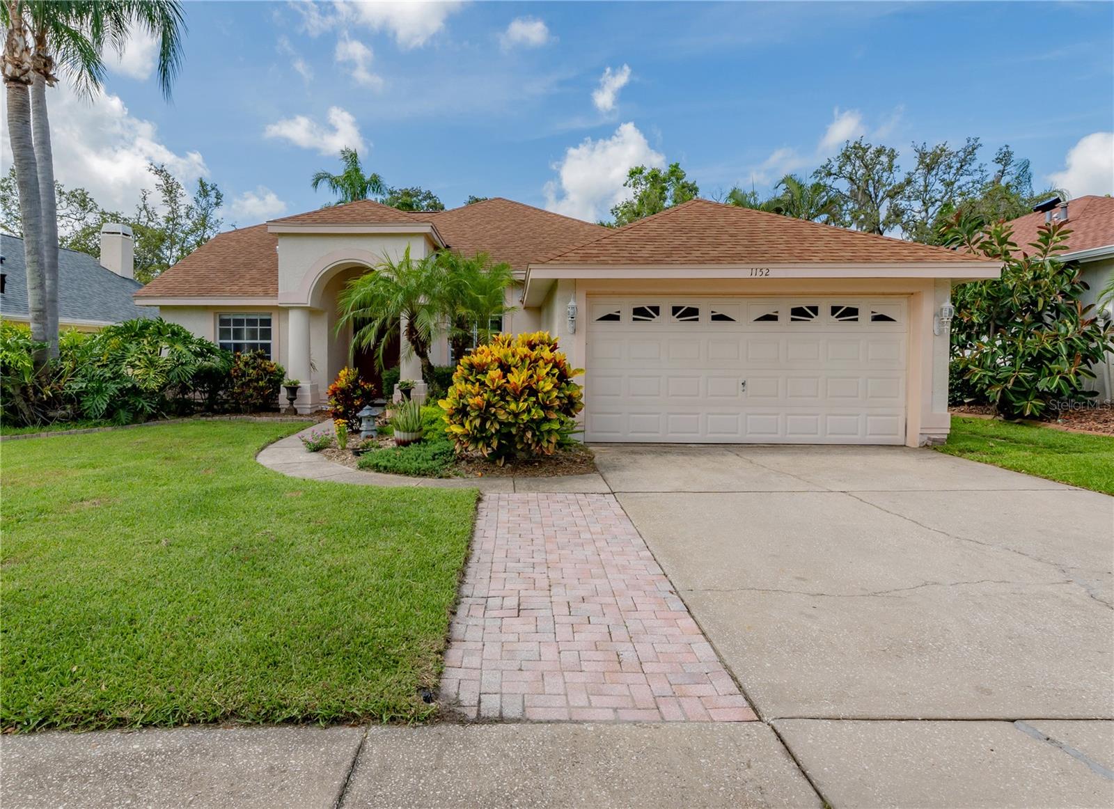 Your Tarpon Springs dream home awaits! Welcome to your own slice of paradise in the highly sought-after Westwinds neighborhood of Tarpon Springs, Florida! This stunning 3-bedroom, 2-bathroom pool home offers the perfect blend of modern comfort and sustainable living. Step inside and discover an open-concept floor plan that's light, bright, and beautifully updated. High ceilings and engineered laminate flooring flow throughout, creating an inviting atmosphere. The spacious kitchen, open to the living room, boasts granite countertops, hardwood cabinets, and stainless steel appliances. The primary bedroom, with its en-suite bath, provides a welcome escape from the hustle bustle, featuring expansive sliders that lead directly to your refreshingly private saltwater pool – perfect for enjoying Florida living every day! But the true gem of this property is the professionally designed food forest, a permaculture masterpiece brimming with a diverse array of fruit trees and edibles, including grapefruit, Barbados cherry, pomegranate, ginger, banana, starfruit, turmeric, papaya, mango, and avocado. Imagine fresh, homegrown produce right at your fingertips! For added peace of mind, this home includes a whole-house water filter and a reverse osmosis system in the kitchen. Additional features include inside laundry and a low $75/month HOA fee. Located in a NON Flood zone, and minutes away from top ranked schools, beaches, restaurants, shopping, historic downtown Tarpon Springs, Pinellas Trail, and the famous Sponge Docks, this Key West model, built by Pioneer, offers a unique opportunity to own a sustainable and luxurious home in a fantastic location. Don't miss out on making this dream home yours!