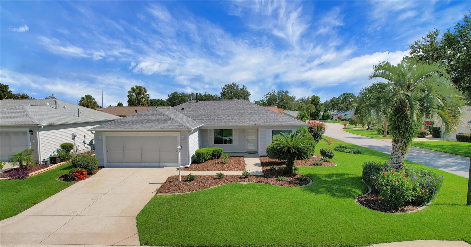 UPGRADES abound on this lovely BOND PAID 3-bed, 2-bath AMARILLO Ranch home in the charming Village of SPRINGDALE, located minutes from Nancy Lopez Legacy restaurants, Mulberry Grove Shopping Plaza, Spanish Springs Town Square, Lake Sumter Landing, and several Championship and Executive Golf Courses – all accessible via golf cart! •• NEW ROOF (03/2023), NEW WATER Heater (April 2024), NEW WINDOWS (March 2022) NEW HVAC (August 2024) NEW Carpet in Master Bedroom (JULY 2025) Water Softener, Extra Cabinets in Laundry room (with soft close feature), New Refrigerator (06/2023), New Microwave (08/2024), New Washer & Dryer (2024) Bird Cage and so much more! Open Floor plan with vaulted ceilings and lots of natural light. Home is handicap accessible in many areas. The kitchen boasts an ISLAND with seating space and extra storage cabinets, ample counter space for cooking prep, a double sink, fridge, stove/oven, microwave, and dishwasher. •• The SPLIT FLOOR plan offers a spacious primary bedroom (only room with carpet and it's NEW) with dual WALK-IN closets, large walk-in shower with seating area and a water closet, while the main living area provides access to the second and third bedrooms and a full bathroom. All bedrooms have ceiling FANS with LIGHTS. Also enjoy the FLORIDA ROOM with Acrylic Windows and tile flooring leading out to the large private birdcage which is great for entertaining or just relaxing. Enjoy your private backyard view with lovely bushes! Call today on this super upgraded, one of a kind home!