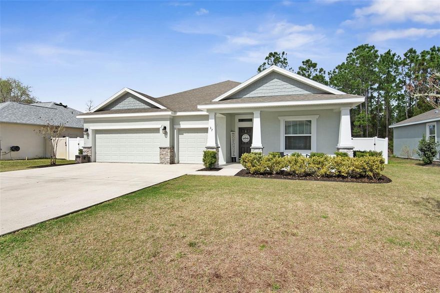 Located in the highly desirable Matanzas Woods neighborhood, just minutes from shopping, dining, and the beach, this beautifully designed new home offers the perfect blend of comfort and style. Featuring an open-concept floor plan, the home boasts a massive Owner’s Suite complete with an oversized walk-in closet, creating a true private retreat. The spacious kitchen showcases 42” upper cabinetry, elegant granite countertops, and a seamless flow into the main living areas — perfect for entertaining or everyday living. Upgrades abound, including granite countertops in both the kitchen and bathrooms, tile flooring in the Owner’s Suite bath, and enhanced vinyl plank flooring throughout all main living areas. Bedrooms are comfortably carpeted for added warmth and relaxation. Energy efficiency is top of mind with features such as a Solar Power Roof Vent and other thoughtfully incorporated energy-saving enhancements. Custom wall details throughout the home add a unique touch of character and craftsmanship, making this new build truly stand out. This is Florida living at its finest — modern, efficient, and ideally located.
