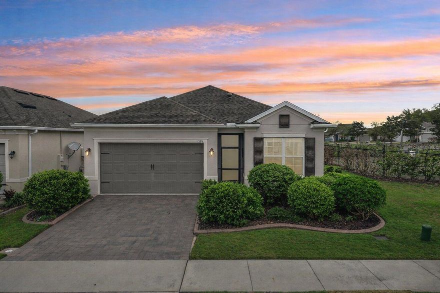 Experience elevated resort-style living in Four Seasons at Orlando, Central Florida’s premier 55+ guard-gated active adult community located just minutes from Walt Disney World in the highly sought-after Four Corners area of Kissimmee. This beautifully maintained 2018 K. Hovnanian residence offers approximately 1,904 square feet of thoughtfully designed living space with 3 bedrooms and 2 bathrooms, blending comfort, privacy, and sophisticated Florida living. The open-concept layout creates an inviting atmosphere for both everyday living and entertaining, anchored by a well-appointed kitchen featuring 42”cabinetry, walk in pantry, stone countertops, high-end stainless steel appliances with gas stove top and a seamless flow into the living and dining areas. The primary suite offers a peaceful retreat with a spacious walk-in closet and private bath, while the additional bedrooms feature beautiful wood flooring, creating warm and elegant guest or office spaces. Designed for comfort and peace of mind, the home includes a whole-home central vacuum system, water softener/filtration and a whole-house Generac generator, providing both convenience and security. Outdoors, the property truly shines with a screen-enclosed private salt water pool and spa, heated by natural gas allowing for year-round enjoyment while taking in serene golf course views with additional privacy screens for enhanced tranquility. The home is ideally positioned on a premium corner lot backing to the golf course, offering scenic views. Additional features include tile flooring throughout the main living areas, ceiling fans, roman shades throughout, irrigation system, natural gas connection, and a two-car attached garage. Residents of Four Seasons at Orlando enjoy access to the impressive Four Seasons Golf and Sports Club, a resort-style clubhouse featuring pools, fitness center, pickleball and tennis courts, walking trails, social events, and an active lifestyle calendar designed specifically for residents 55 and better. Ideally located near ChampionsGate, Reunion, Margaritaville, major highways including I-4 and SR-429, world-class golf, shopping, dining, medical facilities, and Orlando International Airport, this exceptional home offers the perfect combination of luxury active adult living, privacy, and convenience in the heart of Central Florida.