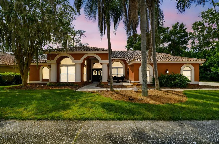 Stunning 4BR/2.5BA pool home on an oversized lot in the gated East Lake Woodlands – Aberdeen community. This airy single-story residence offers over 2,800 sq ft with soaring ceilings, open floorplan, and abundant natural light. The spacious primary suite features private access to the patio, and in the bathroom you will find a walk-in closet, dual vanities, beautiful clawfoot tub, and separate shower. The home also boasts formal living and dining areas, a family room with fireplace, and a bright open kitchen. A large laundry room/wash room combo with exterior access and 3-car garage provide added convenience. Outdoors, relax or entertain with a screen-enclosed pool, covered patio, and mature landscaped yard. Enjoy community amenities including golf, tennis, fitness center, pool, and sidewalks—all ideally located near shopping, dining, top schools, and the Gulf beaches.