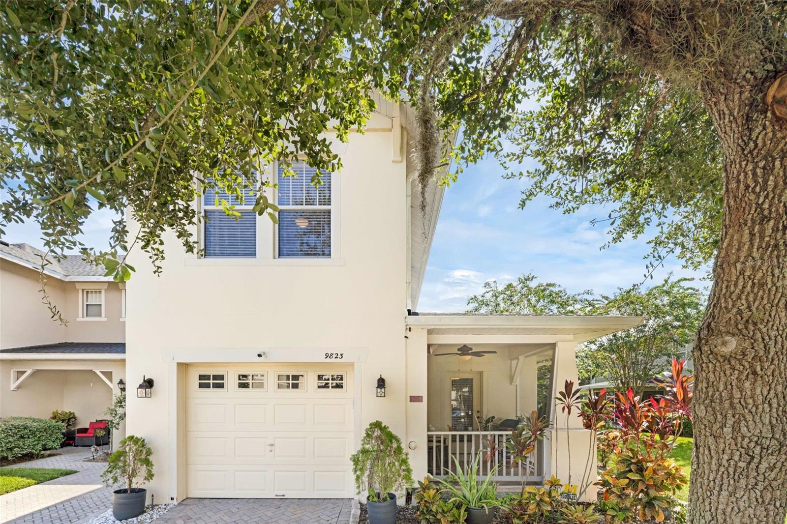 ** A RARE FIND, END-UNIT TOWNHOME WITH FIRST FLOOR PRIMARY BEDROOM** Located in the gated community of Tivoli Gardens, this beautifully updated end-unit townhome blends tranquil views with refined style and worry-free living. Overlooking lush greenspace and a serene pond, the home features two screened-in porches—ideal for quiet mornings or effortless entertaining. Inside, you’ll find an open floorplan enhanced by designer touches, including modern light fixtures, custom ceiling fans, elegant trim work, and rich wood flooring. The spacious primary suite on the first floor features a recently renovated en-suite bathroom (2024), a walk-in closet, and its own screened porch with calming water views.
The gourmet kitchen offers a walk-in pantry and flows seamlessly into the dining and family rooms, creating a warm and functional space. Upstairs, a versatile loft provides the perfect retreat for a home office or media room, along with two additional bedrooms, a full bathroom, and a laundry area. Additional upgrades include a new roof (2023), HVAC and hot water tank (2020), new carpet, and upgraded wood flooring.
Enjoy true maintenance-free living with lawn care, roof upkeep, and scheduled exterior painting—including the screened-in porches—set for August/September. The 1-car garage and extended driveway offer generous parking, and the community amenities include a pool, gate and beautifully maintained common areas—all with low HOA fees.
Located just minutes from major highways and Orlando International Airport, this move-in-ready townhome offers stylish comfort, convenience, and a peaceful lifestyle in one of Orlando’s most desirable gated communities.