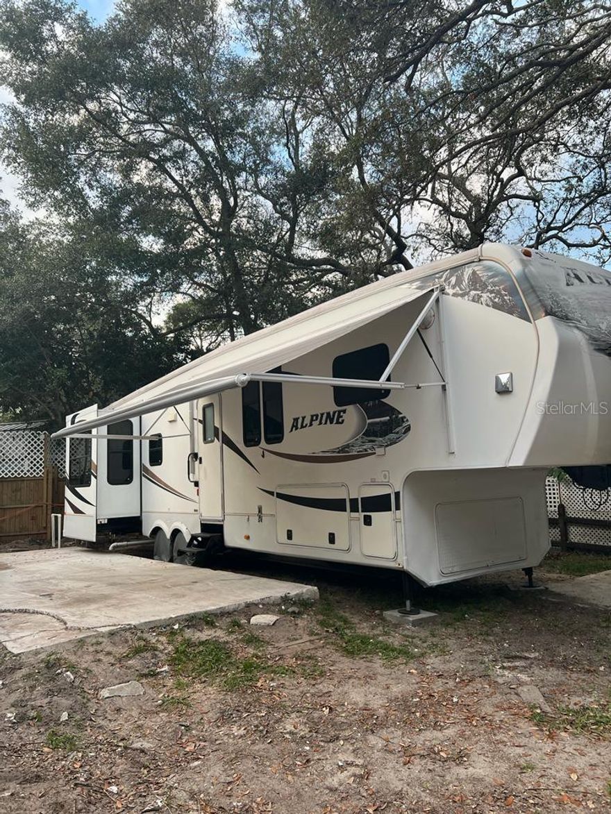 Lot and Rv Alpine 5th weel at  Clarcona Resort.
.  One bedroom, One bathroom includes Refrigerator and Range.  Window AC's, 
Condo dues of $236.13 monthly include water, sewer and trash pick-up and all amenities of the resort.  Sold AS IS.
Good opportunity to Investors.