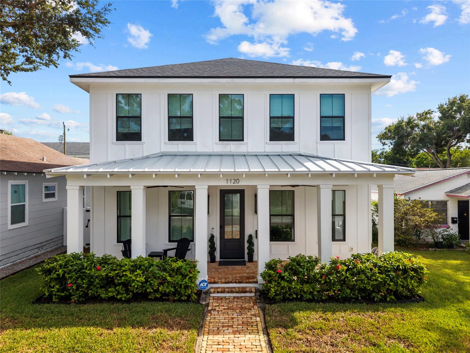Why wait for new construction when this elevated Southern Farmhouse was built in 2020 by well renowned Canopy Builders and is ready for you now? Nestled in the charming and highly sought after Euclid St. Paul's neighborhood, just minutes to downtown Saint Petersburg. This home offers a thoughtful layout, premium finishes, and a detached accessory dwelling unit above the 2-car garage, along with a private pool and spa for true Florida living.
The main residence features 4 bedrooms and 2.5 bathrooms with soaring 10’ ceilings on the first floor and 9’ ceilings upstairs. Quality details include Hardie Plank siding, impact-rated windows, and a ventless gas fireplace. The second level provides two guest bedrooms, a full bathroom, and a dedicated laundry room. The spacious primary suite is a retreat with a large walk-in closet, dual vanities, a freestanding jetted tub, and a marble walk-in shower. This home also provides a unique opportunity, as it is being offered FULLY furnished, with BRAND NEW furnishings throughout.
Every finish was carefully curated by local designers to create a refined yet welcoming atmosphere. Highlights include level 5 quartz countertops, wood-look tile flooring, 8’ shaker-style interior doors, designer lighting, and a premium Samsung appliance package. The chef’s kitchen is a true showpiece, boasting a natural gas range, custom hood, pot filler, farmhouse sink, and oversized island perfect for gathering. Wine enthusiasts will love the custom, temperature-controlled wine closet, designed to hold up to 120 bottles. The first floor also has a full music cast sound system.
Enjoy seamless indoor-outdoor living with a covered rear porch overlooking the pool and spa, ideal for relaxing or entertaining. For added convenience, a private pool bath is located on the first level of the garage.
The accessory dwelling unit provides incredible versatility, featuring its own living room, bedroom, bathroom, and laundry closet. Whether used for extended family, visiting guests, or as an income-producing rental, it adds exceptional value to the property.
Euclid Saint Pauls features a variety of home styles and sizes, and was originally founded back in 1912. The Euclid St. Paul's Neighborhood Association hosts several social functions throughout the year and run on a volunteer basis.
Located just minutes from vibrant Downtown St. Petersburg, I-275, and the Gulf Beaches, this meticulously designed home offers the perfect blend of luxury, functionality, and convenience. AC was replaced in 2025 and has a 10 year transferable warranty.
Experience the best of St. Pete living—make this Canopy Builders custom home yours today.