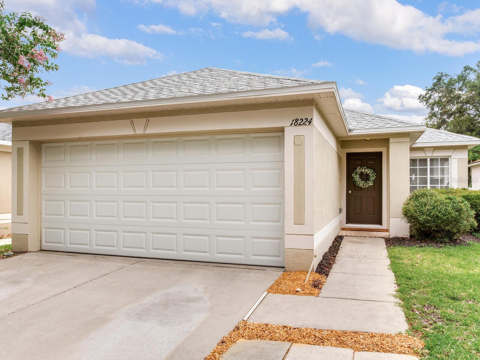 FULLY REMODELED + BRAND NEW ROOF + RESORT STYLE AMENITIES. Step into your BEST Florida life! Welcome to Heritage Isles, a gated community in the desirable area of New Tampa. There is nothing not to love about this turnkey 3 bed/2 bath home with serene pond views. This home provides you a worry-free life! Here you’ll enjoy all new luxury vinyl flooring, fully remodeled kitchen and bathrooms, brand new washer/dryer, new interior paint, new fixtures and fans, newer A/C (2022) and water heater (2023), plus brand new roof (2025), and two-car garage with new garage door. High and Dry, has NEVER flooded in the home's history. The stylish new kitchen features quartz countertops, new stainless steel appliances and a dining nook with elegant chandelier, plus breakfast bar opening up to your main living spaces, a perfect layout for entertaining. Providing open concept living, you’ll love the spacious living room and heigh ceilings, with sliding glass doors leading to your covered lanai. With no rear neighbors, you’ll love the privacy offered here! A split-floor plan has the primary suite in the back of the home. Primary bath featuring dual vanities, a separate soaking tub, shower, and a large walk-in closet. LOW HOA (only $75/YEAR) Amazing resort-style amenities include community pool with children’s splash area, waterslide, and lap lanes, large fitness center, tennis courts, volleyball and basketball courts, playground, clubhouse with activity rooms, community restaurant, plus on-site 18-hole golf course and driving range! There is truly something for everyone here. Located central to shops, endless options for restaurants, and only 30 minutes to downtown Tampa.