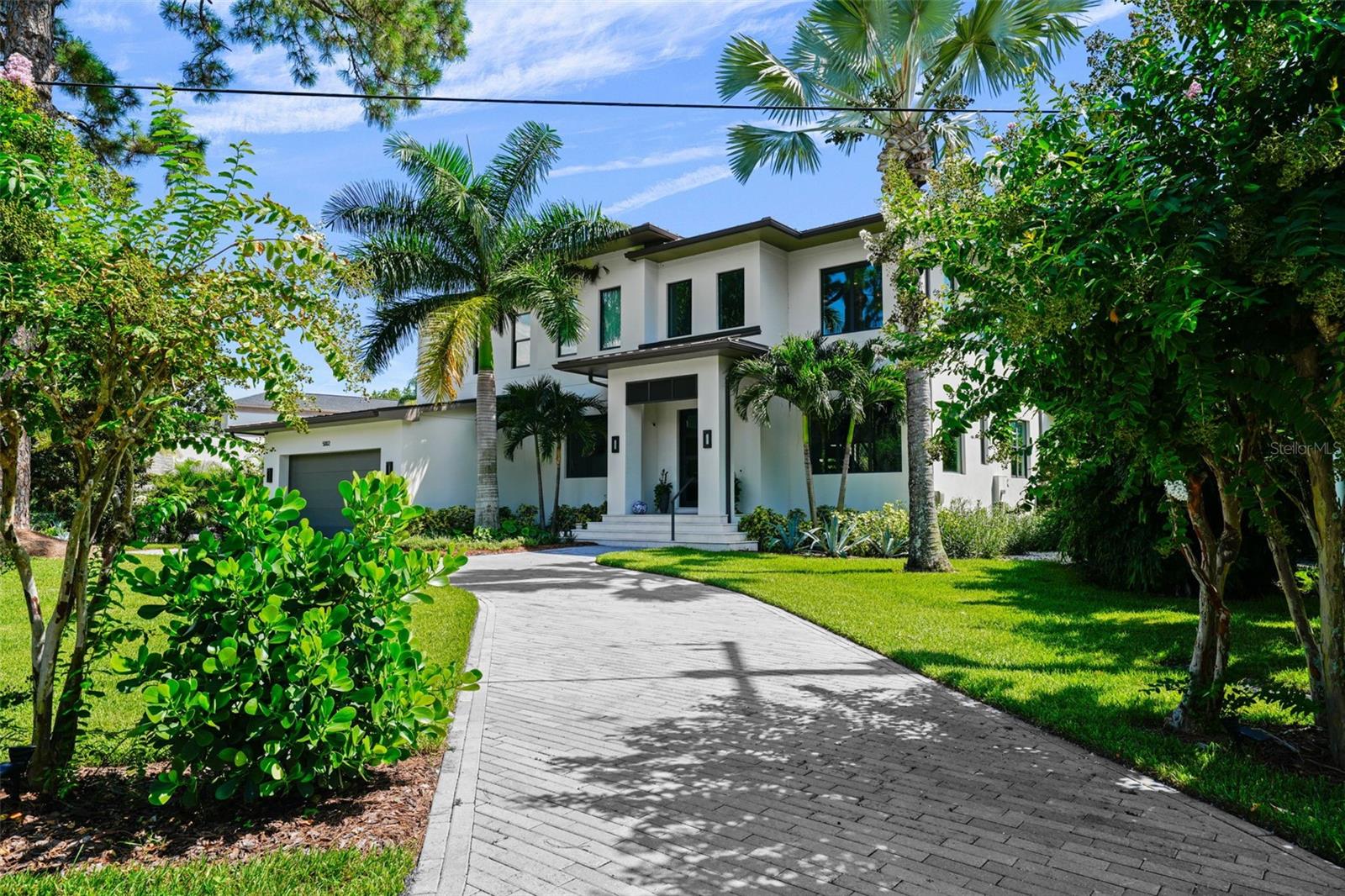 Waterfront home on deep canal in Sunset Park, built in 2017 but looks brand new. 4 bedroom, 4.5 baths, large bonus room, separate office, 3 car garage, pool & spa, both
heated by industrial heater, all laid out on 1/3 acre lot. On the first level you find a large foyer, including an open staircase to the second floor, formal dining room with ceiling
beams and wine storage for over 350 bottles, separate den/offlce, guest suite, and a large open bright kitchen with double island overlooking a huge family room with
decorative ceiling beams as well. The kitchen features SubZero and Wolf appliances, including two dishwashers, large 48" range with range hood, quartz counters, newly
installed new back splash and adjacent walk-In pantry & mud room. The breakfast nook has space for a large table and does have a great breakfast bar as well. Wood tile
flooring covers this entire level. The view from this level features the large covered patio with outdoor kitchen, including a Green Egg, pool and spa and the entire backyard
from the pool to the dock is covered with maintenance free turf, plus easy maintenance landscaping for privacy. The second level contains a large Primary Suite with a large
balcony overlooking the backyard and the canal, huge walk·in closet and a primary bath with separate vanities, large shower and a freestanding tub. In addition, this level
features 2 separale bedroom suites, a large bonus room/media room with wet bar and beverage cooler. Large loft and a great laundry room completes this level. The dock Is
equipped with a 13000 lbs lift wtth capacity up to a 34' boat, and the sunset views from the dock are fantastic!
