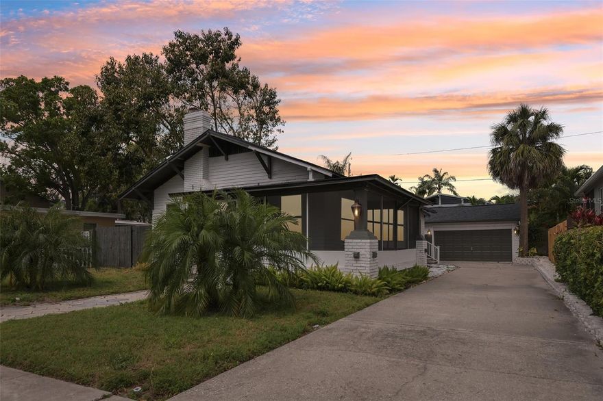 Located in the highly sought-after Riviera Bay area of Northeast St. Petersburg, this beautifully preserved and completely renovated 1925 bungalow is a true gem nestled in the quiet Riviera Bay neighborhood. The home features a brand-new March 2026 30-year dimensional shingle roof with a secondary water barrier and three-nail hurricane clips, helping protect your investment while keeping insurance costs low. A charming screened-in porch wraps around the front and side of the home, creating the perfect space to enjoy your morning coffee or relax in the evening breeze. Inside, you are welcomed by the warmth of original hardwood floors that flow throughout the home, adding timeless character and charm. The inviting living room features a restored brick fireplace and an abundance of natural light, creating a comfortable gathering space. Just beyond, the spacious dining room includes a full-wall window seat with ample storage, making it both beautiful and functional for everyday meals or entertaining. The kitchen is thoughtfully designed and large enough to accommodate an eat-in breakfast area. The primary bedroom offers excellent storage with two closets, while the primary bathroom features a beautifully refinished clawfoot tub perfect for relaxing soaks. The second bedroom also offers generous storage and convenient access to the hall bathroom, and the home includes an indoor laundry area for added convenience. Outside, a long driveway provides plenty of parking and leads to a detached two-car garage with potential to be converted into a mother-in-law suite or guest space. The home is conveniently located near Riviera Bay Park, where residents enjoy scenic recreation trails, an outdoor exercise area, a playground, a boat ramp, and a community garden, making this charming home the perfect blend of historic character and modern comfort in one of Northeast St. Pete’s most desirable areas.