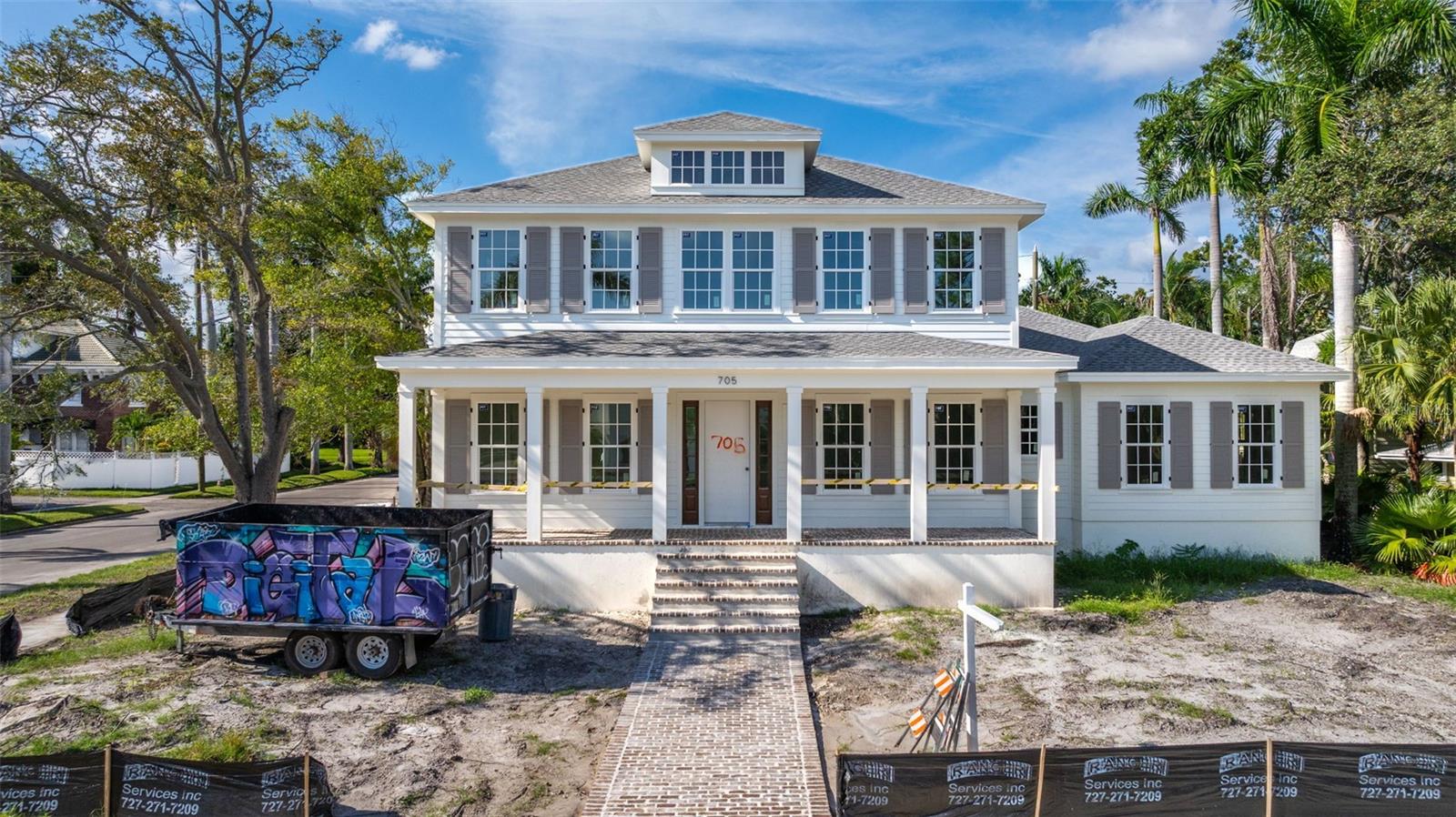 Under Construction. Est. Completion: December 2025 | This is a CANOPY SIGNATURE HOME in collaboration with LAUREN LEITNER DESIGN. Would you love to live just steps from BEACH DRIVE in St. Petersburg’s coveted Historic Old Northeast in a custom designed Canopy Home? Here’s your chance to make that dream a reality with Canopy Builders – St. Petersburg’s most trusted name in luxury home construction. This new build sits on a desirable 89 x 110 sq ft corner lot and offers 4 Bedrooms + Study + Loft, 4 Baths, an oversized 2-car garage, pool and spa, plus an Accessory Dwelling Unit (ADU) with 1 bedroom and 1 bath. The main residence boasts 3,985 sq ft of living space, with the ADU adding 589 sq ft for a total of 4,574 sq ft under air. The ADU includes a full kitchen, laundry, and walk-in closet—ideal for guests, extended family, or rental income. Surrounded by brick streets and mature oak trees, this home blends modern luxury with timeless character, just a 10-minute walk to downtown St. Pete and the waterfront parks. From the welcoming front porch, you enter a foyer with tongue-and-groove paneling and designer lighting, while the formal dining room showcases grasscloth wallpaper, wainscoting, and a statement chandelier. The great room boasts a fireplace and coffered ceilings, flowing seamlessly into the kitchen, designed as both a chef’s dream and a gathering space. The kitchen features a La Cornue range, paneled Sub-Zero refrigerator, Bosch dishwasher, and inset custom cabinetry, anchored by a white oak island with Calcutta marble countertops, tongue-and-groove ceiling, and a custom reeded range hood. A breakfast nook with a gold pendant sits just beyond, while the butler’s pantry impresses with a paneled Avalon wine cooler, deep green cabinetry, brass shelving, marble counters, and gold hardware. The main level also includes a mudroom with dark cabinetry and brick herringbone flooring, a powder room with wallpaper and a soapstone vanity, and a laundry with custom cabinetry, marble checkerboard floors, and Calcutta counters. The primary suite offers wood-beamed ceilings and a spa-like bath with gold accents, fluted vanities, and Calcutta marble. Upstairs, a loft opens to three bedrooms, each with its own en suite, including designs with navy handcrafted tile and dark wood vanity, gingham tile with marble accents, and a white reeded vanity with silver hardware. The upstairs laundry includes deep green tile, Carrera marble counters, and soft white cabinetry. Canopy not only designed the interior but also customized all exterior finishes. Out back, enjoy a custom pool and spa, outdoor kitchen with grill and brick hood, and lush surroundings. The detached ADU includes quartz counters, white cabinetry, and subway tile backsplash. Planned features include Hardie Board siding, a tankless gas water heater, impact-resistant windows, and engineered hardwood floors throughout. Dual digital thermostats allow independent climate control. Additional luxuries include 10’ ceilings on the first floor, 9’ ceilings on the second, 8’ interior doors, and Canopy’s signature gas sconces on the porch. This home is walking distance to waterfront North Shore Park, biking distance to downtown, and just a 20-minute drive to St. Pete Beach or Tampa. Contact us to learn more about the custom finishes that make this home truly one of a kind.