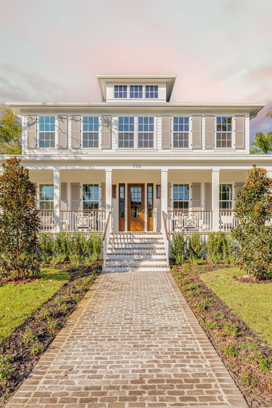 This is a CANOPY SIGNATURE HOME in collaboration with LAUREN LEITNER DESIGN. Would you love to live just steps from BEACH DRIVE in St. Petersburg’s coveted Historic Old Northeast in a custom designed Canopy Home? Here’s your chance to make that dream a reality with Canopy Builders – St. Petersburg’s most trusted name in luxury home construction. This new build sits on a desirable 89 x 110 sq ft corner lot and offers 4 Bedrooms (FIRST-FLOOR PRIMARY SUITE) + Study + Loft, 4 Baths, an oversized 2-car garage, pool and spa, plus an Accessory Dwelling Unit (ADU) with 1 bedroom and 1 bath. The main residence boasts 3,985 sq ft of living space, with the ADU adding 589 sq ft for a total of 4,574 sq ft under air. The ADU includes a full kitchen, laundry, and walk-in closet—ideal for guests, extended family, or rental income. Surrounded by brick streets and mature oak trees, this home blends modern luxury with timeless character, just a 10-minute walk to downtown St. Pete and the waterfront parks. From the welcoming front porch, you enter a foyer with tongue-and-groove paneling and designer lighting, while the formal dining room showcases grasscloth wallpaper, wainscoting, and a statement chandelier. The great room boasts a fireplace and coffered ceilings, flowing seamlessly into the kitchen, designed as both a chef’s dream and a gathering space. The kitchen features a La Cornue range, paneled Sub-Zero refrigerator, Bosch dishwasher, and inset custom cabinetry, anchored by a white oak island with Calcutta marble countertops, tongue-and-groove ceiling, and a custom reeded range hood. A breakfast nook with a gold pendant sits just beyond, while the butler’s pantry impresses with a paneled Avalon wine cooler, deep green cabinetry, brass shelving, marble counters, and gold hardware. The main level also includes a mudroom with dark cabinetry and brick herringbone flooring, a powder room with wallpaper and a soapstone vanity, and a laundry with custom cabinetry, marble checkerboard floors, and Calcutta counters. The primary suite offers wood-beamed ceilings and a spa-like bath with gold accents, fluted vanities, and Calcutta marble. Upstairs, a loft opens to three bedrooms, each with its own en suite, including designs with navy handcrafted tile and dark wood vanity, gingham tile with marble accents, and a white reeded vanity with silver hardware. The upstairs laundry includes deep green tile, Carrera marble counters, and soft white cabinetry. Canopy not only designed the interior but also customized all exterior finishes. Out back, enjoy a custom pool and spa, outdoor kitchen with grill and brick hood, and lush surroundings. The detached ADU includes quartz counters, white cabinetry, and subway tile backsplash. Planned features include Hardie Board siding, a tankless gas water heater, impact-resistant windows, and engineered hardwood floors throughout. Dual digital thermostats allow independent climate control. Additional luxuries include 10’ ceilings on the first floor, 9’ ceilings on the second, 8’ interior doors, and Canopy’s signature gas sconces on the porch. This home is walking distance to waterfront North Shore Park, biking distance to downtown, and just a 20-minute drive to St. Pete Beach or Tampa. Contact us to learn more about the custom finishes that make this home truly one of a kind.