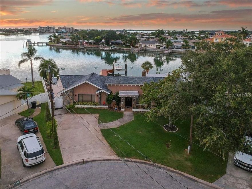 LOCATION LOCATION LOCATION Unique opportunity to own a beautiful waterfront oasis on a spectacular "point" lot with 160 Ft of seawall. The location at the end of a cul-de-sac with stunning sunsets and wide open-water views of the Boca Ciega Bay.Make this an incredible one-of-a-kind opportunity to restore this home or build a brand new home. if you enjoy the water/beach life. Large, oversized back patio with lots of room for entertaining family and friends complete with a large pool .This home was affected by Hurricane Helene and has been remediated. All new seawall and dock plus 16,000 lbs boatlift and deep water access. Watch as the dolphins and manatees and other wildlife play right off your dock and enjoy the boats cruising by on the intracoastal waterway. Fantastic location, within one mile to the sandy white beaches, lots of unique shops in coveted Treasure Island and countless restaurants etc. Quick access to I-275 and just 15 minutes to downtown St. Petersburg with all the fun and entertainment possibilities that it has to offer. Make your appointment today before it's gone.
Restore the home to pre hurricane conditions: Outdoor kitchen area and direct convenient access to the pool bath w/shower without entering the house. Large one-story home with 3 bedrooms and 4 full baths.You will be mesmerized by the stunning water views as you enter and walk through the family room/ great room with a stunning stone wood burning fireplace. This tropical waterfront home features a split floor plan with each bedroom having an en-suite bath. Wake up to sweeping pool and water views from your master suite complete with sliding glass doors leading you to the pool area. Indoor laundry room.