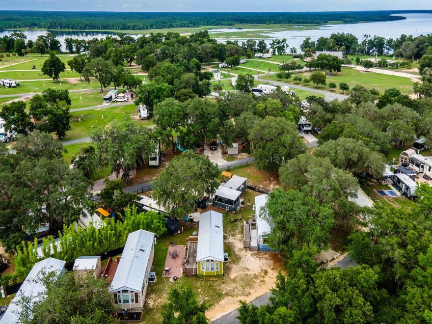Cozy, Updated Cabin Retreat in KOA Oklawaha Campground – 15991 NE 243 Place Rd Unit 32, Fort McCoy, FL 32134
Offered at $120,000 | 1 Bed | 1 Bath | Approx. 450 Sq Ft on .06 Acres

Welcome to Unit 32 in the peaceful and amenity-rich KOA Oklawaha Campground—a perfect getaway for seasonal living, multi-family use, or vacation rental income through Airbnb or Vrbo. This updated cabin offers comfort, privacy, and a gateway to endless Florida outdoor adventures.

This charming 1-bedroom, 1-bathroom mobile home includes an open living space, a built-in kitchen, and a private wood deck, great for morning coffee or evening relaxation. Whether you’re a snowbird, weekend explorer, or investor, this is a move-in-ready opportunity in a vibrant campground community.

Recent Upgrades & Maintenance Highlights:

- Roof, floors and siding replaced in 2024

- HVAC replaced in 2024

- Reinforced strapping installed for secure ground attachment (previously required by county code)

- Maintained with care and ideal for low-hassle ownership

Resort-Style Community Amenities Include:

- Pool, clubhouse, and dog park

- Beach area, playground, volleyball, corn hole

- ATV riding trails and nature paths leading to a lake overlook

- Family-friendly environment with something for every age group

Prime Location Benefits:

- Minutes to downtown Fort McCoy for groceries, pharmacy, doctor’s office, gas, hardware, and dining

- Just 30 miles to Ocala for full urban convenience

- Close to numerous springs, lakes, and the Ocala National Forest—ideal for boating, kayaking, fishing, hunting, and trail riding

?? HOA includes electric, water, sewer, trash, and full use of all amenities.

Whether you're seeking an affordable Florida retreat, a multi-generational camp spot, or an income-producing vacation rental, Unit 32 is turnkey, updated, and ready for you.

Schedule your private tour today!