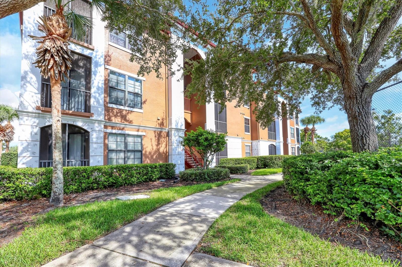 Delightful third-floor condominium offers casual coastal living in a resort style setting. This charming condo provides the perfect opportunity to embrace the relaxed Serenata lifestyle, where you can stroll around the serene lake, play tennis, work out in the fitness center, or simply unwind by the heated pool and lakeside sundeck, just steps away. You will appreciate the Great Room design, featuring soaring vaulted and 9' ceilings that create an open and airy feel. Oversized hurricane windows and balcony doors lead to your private screened lanai, complete with a roomy storage closet. Inside, you'll find built-in shelves in the great room, kitchen with breakfast bar for casual dining, walk-in closet in the bedroom, and a convenient interior laundry room with storage shelves. The condo boasts neutral decor, luxury vinyl floors in the great room and bedroom, tile in the kitchen and bath, furniture-quality wood cabinets, and all appliances, including a washer and dryer. For your peace of mind, the unit includes a 2021 hot water heater and a 2018 A/C unit, along with low monthly fees and a completed RIS Study. Please note, there is a lease currently in place through September 30, 2025. Serenata is a private, gated, and maintenance-free community, beautifully nestled around a lake with fountains and lush tropical landscaping. Residents enjoy a fantastic recreational lifestyle with amenities including resort-style heated pool, lakeside sundeck, lighted tennis court, scenic walkway around the lake, state of the art fitness center, and a beautifully appointed resident clubhouse featuring a media lounge, game room, and business office, plus a convenient car washing station. This exceptional location in the University Parkway area offers unparalleled convenience and accessibility to shopping, dining,recreational pursuits, pharmacies, banks, UTC Shopping Mall and Nathan Benderson Park with a premiere rowing facility. I-75 is easily accessible for travel north and south, SRQ Airport is just a short drive away. You'll love the close proximity to the arts and culture and diverse cuisine of downtown Sarasota, the boutique shopping and dining of St. Armand's Circle, and our gorgeous Gulf Coast Beaches!