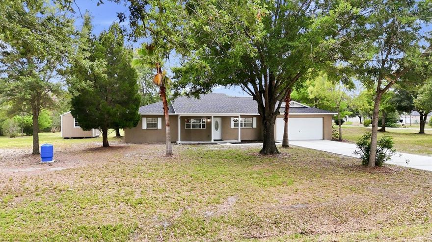 THIS IS THE ONE!  Live in a COUNTRY-LIKE SETTING without the long drive to everything!  You won't want to miss out on this SPECTACULAR OPPORTUNITY to own a BEAUTIFULLY RENOVATED home on a 1.13 ACRE, CORNER LOT in Wesley Chapel with NO HOA or CDD!  Access the MASSIVE BACKYARD via Little Lane for added convenience!  The possibilities are endless for all this land...Add an outdoor oasis with sparkling pool, store your RV, raise some chickens, grow your own vegetables, build a workshop &/or In Law Suite... the decision is yours!  Recently UPDATED & UPGRADED in 2026, this home is MOVE-IN READY and features BRAND NEW: ROOF, HVAC with NEST digital thermostat, HOT WATER HEATER, WATER SOFTENER, FLOORING, BASEBOARDS, INTERIOR PAINT, LIGHT FIXTURES & SWITCHES, MOEN & DELTA PLUMBING FIXTURES, COMFORT HEIGHT TOILETS, CEILING FANS (with remote control), SOFT CLOSE CABINETS, QUARTZ COUNTERTOPS, STAINLESS STEEL APPLIANCES & MORE!  Step inside this DREAM HOUSE to find ALL NEW Commercial Grade neutral color, wood like LUXURY VINYL WIDE PLANK FLOORING with 5" decorative baseboards THROUGHOUT ALL LIVING AREAS.  The SPACIOUS LIVING ROOM spans from front to back and has a VAULTED CEILING and DUAL CEILING FANS as well as a BAY WINDOW and an ACCESS DOOR to the back patio with double pane window & built-in blinds.  The TASTEFULLY REMODELED KITCHEN features all NEW SOFT CLOSE DRAWERS & CABINETS (white uppers and grey lowers), COODINATING QUARTZ COUNTETOPS, a PULL-OUT SPICE RACK, DUAL CORNER CABINETS with LAZY SUSAN spinning trays for maximum space utilization, a FRIGIDAIRE GALLERY SERIES stainless steel appliance package, including a RANGE with CONVECTION OVEN & AIR FRYER capabilities, a stainless-steel FARM STYLE SINK that OVERLOOKS the BACKYARD and a spacious pantry closet.  A DESIRABLE SPLIT BEDROOM Floor Plan with the Primary Suite on one side of the house and the secondary bedrooms and bath on the other.  You're sure to love the PRIMARY "WING" boasting a bedroom, an en-suite bath, a walk-in closet PLUS an ADJOINING BONUS ROOM/Flex Space to use as your office, den, nursery, gym or whatever you wish!  The bonus room also has an access door to the back yard and patio, providing a convenient second rear entrance to this amazing home.  The primary bath features NEW SOFT CLOSE CABINETS AND DRAWERS with COORDINATING QUARTZ COUNTERTOP & DUAL SINKS, white faucets, PICTURE MIRRORS, TILE FLOORING, a SPACIOUS walk-in shower with deco tile, MOEN faucet and DUAL SHOWER heads + a built-in CORNER SEAT as well as a built-in shelf for hair products, etc.  The Primary bedroom Walk-in Closet offers hanging shelves and a HANDY STORAGE CABINET for linens and more.  On the opposite side of the house is a hallway with linen closet leading to two bedrooms and a full bath with TUB/SHOWER COMBO & sliding glass door. ALL UPGRADES CARRY SEAMLESSLY THROUGH THE ENTIRE HOUSE.  Out back there are TWO STORAGE SHEDS to keep your garage free of clutter so you can actually park your car in it!  NO WATER/SEWER BILLS to worry about here as you have your own well & septic.  Live in the country, but close to everything!  Only minutes away from shopping, restaurants, entertainment (Epperson Lagoon, Movie Theatre, Ice Skating) & more with The Grove and KRATE nearby plus The Outlet Mall and Wiregrass Town Center only 15 minutes away.  Get to Downtown Tampa or Tampa Airport via I75-275 in about 30-40mins and our famous West Coast sugar sand beaches in 45-60mins. PHSC, USF & UT all within a short drive