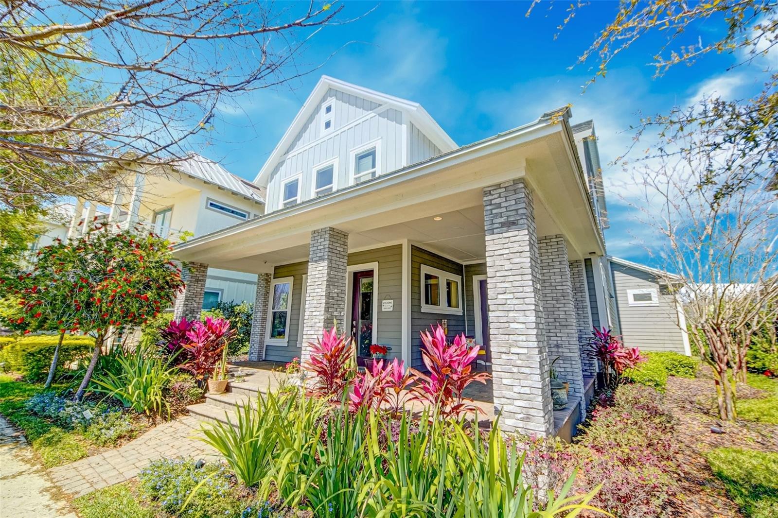 One or more photo(s) has been virtually staged.
**RARE FIND** – FULLY UPGRADED DAVID WEEKLEY with LAKEVIEWS ON A QUIET STREET** Vacant and ready for immediate move-in! This LAKEFRONT HOME features the David Weekley “Reef” floorplan, offering 4 bedrooms, 3.5 bathrooms, and a 3-car garage, plus an ADDITONAL OFFICE, perfectly situated to capture stunning SUNSET VIEWS over the water. Located on a quiet street in Laureate Park, this home showcases PREMIUM UPGRADES INSIDE & OUT, including an expansive covered wraparound porch ideal for enjoying the peaceful lakefront setting. Additional features include PREMIUM built-in SPEAKERS throughout the entire home, custom outdoor kitchen & grill, a heated SALTWATER pool & spa, home water softener system, two wine coolers, and an owned propane tank that fuels both the pool heater and outdoor stove. Inside, the home boasts wood-plank tile flooring, HIGH CEILINGS with exposed wood beams, upgraded light fixtures, and an open-concept design that seamlessly connects the living, dining, and kitchen areas. A dedicated OFFICE WITH LAKE VIEWS provides a serene workspace. The GOURMET KITCHEN is a true showstopper, featuring quartz countertops, stainless steel appliances, a designer range hood, wine refrigerator, custom sink, and a large island wrapped in beadboard—perfect for entertaining. The first-floor owner’s suite is a luxurious retreat with wood beam accents, a spa-like bathroom offering stone countertops, dual vanities, and a walk-in super shower. Upstairs, you'll find a spacious loft/family room and three additional bedrooms, providing comfort and flexibility for family or guests. Step outside to a private backyard oasis complete with a sparkling pool and spa, a fully fenced yard, and a fully upgraded outdoor kitchen and grill. Located in the heart of Laureate Park, this home provides access to top-tier amenities including community POOLS, FITNESS center, RESTAURANTS, parks, trails, and is just minutes from Lake Nona Town Center, 417, medical facilities, and innovative transportation options such as autonomous BEEP shuttles and the Lilium vertiport. This is a rare opportunity to own a move-in-ready, FULLY UPGRADED LAKEFRONT HOME in one of Orlando’s MOST DESIRABLE COMMUNITIES! Schedule your private showing today!