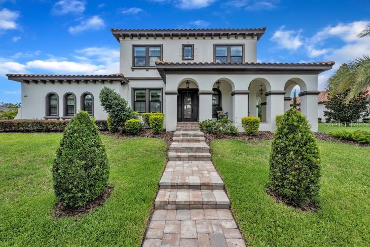 Welcome to this STUNNING Cardel Homes “Waldorf” plan featuring 4 Bedrooms + office, 4 Baths, 3-Car garage and a custom designed pool with infinity edge spa! You will not be disappointed with this LUXURY EXECUTIVE DREAM HOME nestled on a premium lush lot with a tropical oasis feel. Enjoy TOP-OF-THE-LINE upgrades including gleaming hardwood floors, tons of crown molding, wide baseboards, plantation shutters, surround sound speakers and much more. You will be in AWE of the KNOCKOUT CHEF’S KITCHEN offering Cambria countertops, a huge center island and upgraded, Wolf, built-in stainless appliances with a SUB-ZERO fridge. There is a double-sided modern fireplace with stone accents, custom barn doors leading into the GRAND BONUS ROOM which is the perfect entertainment area! Relax in your LUXURIOUS MASTER EN-SUITE BATH with dual sinks, a stand alone soaking tub and oversized walk-in shower. The two walk-in master closets have custom "California Closet" built-ins for maximum organization and storage space. The design of this Mediterranean style ELEGANT home will have you falling in love instantly! The oversized, screened lanai with a deluxe outdoor kitchen, is perfect for entertaining and will leave you breathless. Located in one of Tampa’s most coveted luxury communities, surrounded by protected conservation land, mature oaks, and abundant wildlife. Residents of The Preserve enjoy world-class amenities, including clubhouses, resort pools, tennis courts, fitness centers, playgrounds, and 25+ miles of trails. Zoned for A-rated schools and minutes from shopping, dining, Tampa, MacDill AFB, and Florida’s beautiful beaches—this home truly has it all.