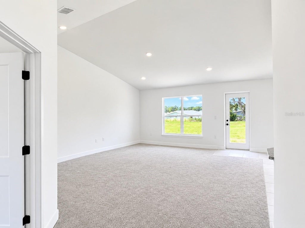 Photo of 1684 Ann Rose Way, Leesburg, FL 34748 (MLS # O6423122)
