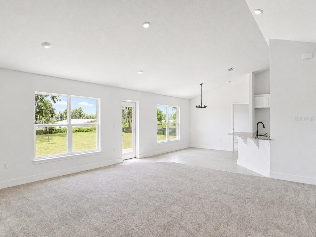 Photo of 1684 Ann Rose Way, Leesburg, FL 34748 (MLS # O6423122)