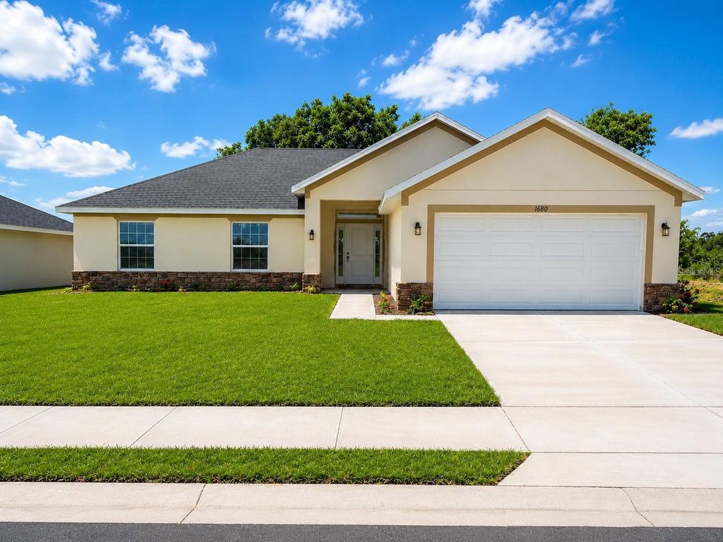 Photo of 1684 Ann Rose Way, Leesburg, FL 34748 (MLS # O6423122)