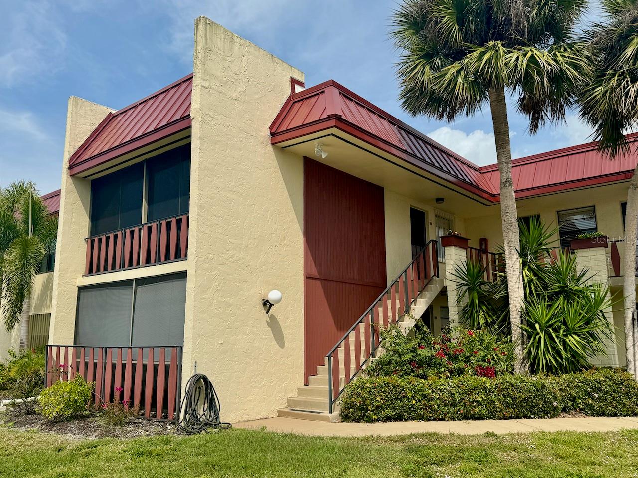 This 2nd-floor corner Riverhouse unit offers the perfect blend of affordable resort-style living and prime location—just minutes from the beautiful Gulf of Mexico beaches. Fully furnished and move-in ready, this home includes convenient features like an IN-UNIT WASHER AND DRYER. Recent updates, including a NEWER A/C and WATER HEATER (2020), along with a wireless thermostat, ensure modern comfort. The charming Spanish tile floors add character, and built-in cabinets and a desk in the living room provide extra storage and organization. Enjoy your morning coffee or unwind after a day at the beach on the screened-in balcony, which offers a serene space to relax. The low HOA fee of just $366/month covers an impressive range of amenities, including access to two large pools (one heated), tennis courts, shuffleboard, and a community center offering various social clubs and activities. Additionally, the HOA fee includes water, sewer, and trash services—a real value! Located in Rotonda West, you'll be surrounded by 5 beginner-friendly golf courses, scenic canals for fishing, and bike and walking trails. This community truly offers a special spot in paradise—ideal for enjoying the best of Florida’s laid-back lifestyle in a prime location.