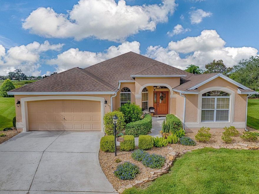 BOND PAID! TURNKEY! ROOM FOR A POOL! Welcome to this beautifully maintained 3/2 Gardenia model nestled on a quiet cul-de-sac lot with no homes behind in the sought-after Village of Caroline. From the moment you arrive, the impeccable curb appeal stands out featuring lush, manicured landscaping. The glass-insert front door with side lite and transom window sets the tone for elegance inside. Step through the foyer to find high ceilings, updated lighting throughout, PLANTATION SHUTTERS, and an open, light-filled layout perfect for entertaining. The spacious living and dining areas flow seamlessly together, while the kitchen boasts maple cabinetry with pull-out shelves, under and over cabinet lighting, GRANITE, stainless steel appliances, a GAS range, closet pantry and a wood-look enhanced breakfast bar. Enjoy casual dining in the sunlit breakfast nook. Stacked sliding glass doors open from the living room to a beautiful, ENCLOSED LANAI with tile flooring and is ideal for year-round enjoyment. Just beyond, a large pergola offers a perfect space for outdoor seating, dining, or simply relaxing while overlooking the peaceful preserve view. The spacious primary suite features vaulted ceilings, dual closets, and an ensuite bath with dual sinks, vanity and a walk-in shower. On the other side of the home, a pocket door separates the guest wing for privacy. The first guest bedroom includes a built-in desk, vaulted ceilings, and double-door closet—perfect for use as a home office. The second guest room offers ample space and another double-door closet, with a guest bath featuring a tub/shower combo conveniently located between them. The laundry room is fully equipped with a SOLAR TUBE allowing natural light to flow into the space, and utility sink. The 2-car garage includes a painted floor, pull-down attic stairs, and ample storage space. Other updates include ROOF 2020 and HVAC 2015.  Located just 1 mile from Lake Sumter Landing, this home is close to Caroline Pool, Coconut Cove Recreation Center, and Mallory Hill Country Club. Residents enjoy access to multiple recreation centers — including Caroline Neighborhood Recreation Center with an adult pool, and Coconut Cove Village Recreation Center featuring a family pool and outdoor activities. Room for a pool will need to be verified with county and The Villages.
