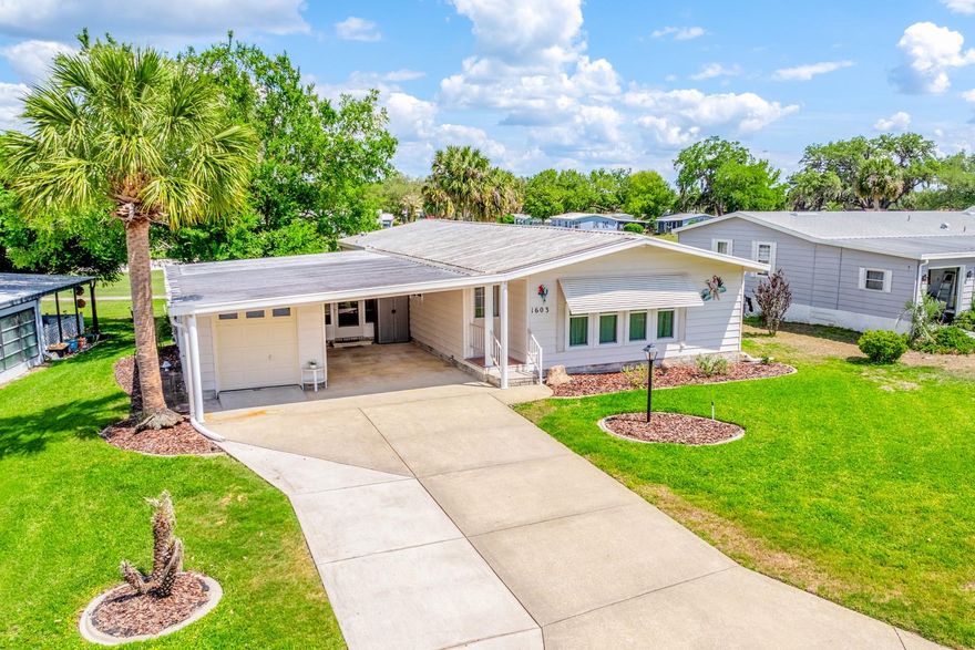 One or more photo(s) has been virtually staged. Welcome to easy Florida living with GOLF COURSE VIEWS you will enjoy every single day! Perfectly positioned on the 14th green in the desirable Orange Blossom Gardens section of The Villages, this adorable 2-bedroom, 2-bath + Florida Room + GARAGE home delivers a seamless layout, convenience, and a lifestyle that’s hard to beat. Recent UPDATES are already in place – starting with the EXTERIOR POST & SOLAR LAMP LIGHT (2026) to welcome you home, followed by a full home RE-PIPE & NEW WATER HEATER (2022) for added peace of mind. In (2020), the home saw major improvements including a NEW A/C and a beautifully upgraded kitchen featuring smudge-proof LG STAINLESS STEEL APPLIANCES. DOUBLE-PANE WINDOWS (also double-hung) were installed in (2018), enhancing energy efficiency and natural light throughout. Inside, you will be delighted to find a bright, open flow from the living and dining areas into the kitchen, ideal for everyday living or entertaining family and friends. The kitchen stands out with a vaulted ceiling, solid wood cabinetry, tiled backsplash, pantry storage, a built-in desk, and a cozy breakfast nook. UPDATED LIGHTING and ceiling fans throughout, along with CUSTOM DOUBLE-HUNG BLINDS, add a polished touch throughout the home. The FLORIDA ROOM (under air!) provides valuable flexible space – perfect for a home office, hobby room, or additional lounge area. The PRIMARY SUITE offers a WALK-IN CLOSET and private en-suite bath, while the second bedroom is conveniently located near a full guest bath – ideal for visitors. Step outside on the PAVER patio and take in the GOLF COURSE FRONTAGE with peaceful views of the 14th GREEN, creating a relaxing backdrop for your morning coffee or evening unwind. ****Some furnishings may be included, and a ****2014 Yamaha electric GOLF CART is available to convey, making it even easier to start enjoying The Villages lifestyle right away! Other updates include: new garage door (2018), Leaf-fitters gutter guards installed (2019), new irrigation valves and control board (2019), roof cleaned and resealed (2019), new AC thermostat (2019). Located just around the corner from the Hilltop Pool & Recreation Center, and close to shopping, dining, UF Health, BJ’s Wholesale, and nearby resorts and hotels, this home puts everything you need within easy reach. Residents of The Villages enjoy access to an unmatched array of amenities including golf, pools, recreation centers, entertainment, and social activities. Orange Blossom Gardens is ready to welcome you home – schedule your tour today and come see what makes this one so special!