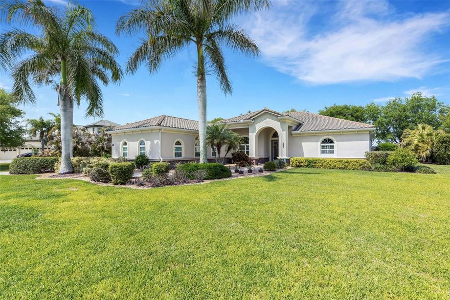 Originally an upgraded builder’s Model Home, conveniently located just inside the premier community of Rye Wilderness , this gracious 3-bedroom, 3-bath, 3 garage home with a large bonus room sits on a Half-Acre Lot.  Upgrades include an impressive stone accent wall, crown molding, tray ceilings, and quartz countertops throughout. The expansive open floor plan offers easy living and effortless entertaining.  This is the home where everyone wants to gather, with the living room opening to a large lanai, HEATED SALTWATER POOL and SPA, and multiple seating areas.  The split floor plan provides privacy and comfort for the primary suite, which features an en suite bathroom with a garden tub, zero-entry shower, dual sinks, a spacious linen closet, and two John Lewis custom-designed walk-in closets.  On the opposite side of the home, you’ll find two additional bedrooms—each with walk-in closets—two bathrooms, and a large bonus room with sliding glass doors to the lanai, perfect for a home office, den, or game room.  The current homeowners have added significant value, including a NEW WATER HEATER (2021) & LENNOX 5 TON A/C (2021) WITH MEDICAL GRAD FILTRATION, a whole-house water purification system, a home generator, wooden plantation shutters, whole house gutter system and Smart Sprinkler System. The roof is cement tile, new in 2014. The three-car garage has been upgraded with new door lifts that recess to the ceiling.  These are just some of the features that make this home an exceptional find. Schedule your tour today and pick up the extensive list of all upgrades. With no CDD fees and low HOA fees, this may be the perfect home for you!