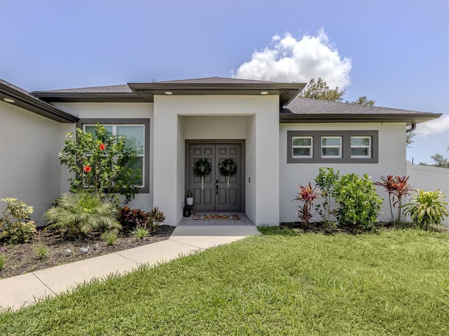 Discover modern elegance in this beautifully constructed 2022 North Port home! Spanning over 1,849 square feet of living space, this custom-built residence features a thoughtful open-concept layout with a split floor plan, offering three spacious bedrooms, a versatile den/office, and two luxurious baths. The two-car garage provides ample storage. Upgraded with impact windows and doors, waterproof luxury vinyl flooring, soft-close cabinetry, quartz countertops and stylish recessed lighting, every detail reflects quality and sophistication. The primary suite boasts walk-in closets, a double vanity and a pristine walk-in shower, while large sliders open to a generous 27-foot screened lanai and expansive paver patio, ideal for entertaining. On nearly a quarter-acre with a vinyl privacy fence, this home offers privacy and outdoor living. High ceilings and premium finishes create an inviting and modern atmosphere. Conveniently near shopping, top-rated schools, beaches and popular attractions like Mineral Springs and the North Port Aquatic Center. This home qualifies for a no-money-down, no-mortgage insurance required loan. Don’t miss this incredible opportunity and schedule your private showing today.