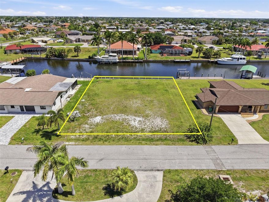 Experience the ultimate Southwest Florida boating lifestyle with this exceptional oversized waterfront lot in desirable Port Charlotte. Offering 100 feet of water frontage, a concrete seawall, and true sailboat access with direct open water connectivity, this property is the perfect canvas to build your dream home in paradise. With no bridges to navigate, enjoy effortless access to Charlotte Harbor and the Gulf beyond.

PROPERTY OVERVIEW:
• Oversized waterfront homesite
• 100 feet of water frontage
• Concrete seawall in place
• Sailboat access (no bridges)
• Direct access to open water
• Ideal for custom home construction

WATERFRONT FEATURES:
• Prime canal location with wide water views
• Concrete seawall already installed
• Perfect for private dock and boat lift
• Quick boating access to Charlotte Harbor
• Excellent opportunity for serious boaters

BUILDING OPPORTUNITY:
• Generous lot size for flexible home design
• Plenty of space for pool, outdoor living, and garage
• Ideal for custom luxury or seasonal residence
• Surrounded by well-maintained waterfront homes

LOCATION HIGHLIGHTS:
• Located in growing Port Charlotte community
• Close to shopping, dining, and medical facilities
• Easy access to golf courses and parks
• Short drive to Gulf beaches and barrier islands

An outstanding opportunity to secure a premium sailboat-access waterfront lot with direct open water access—perfect for building your custom coastal retreat in one of Southwest Florida’s most sought-after boating communities.