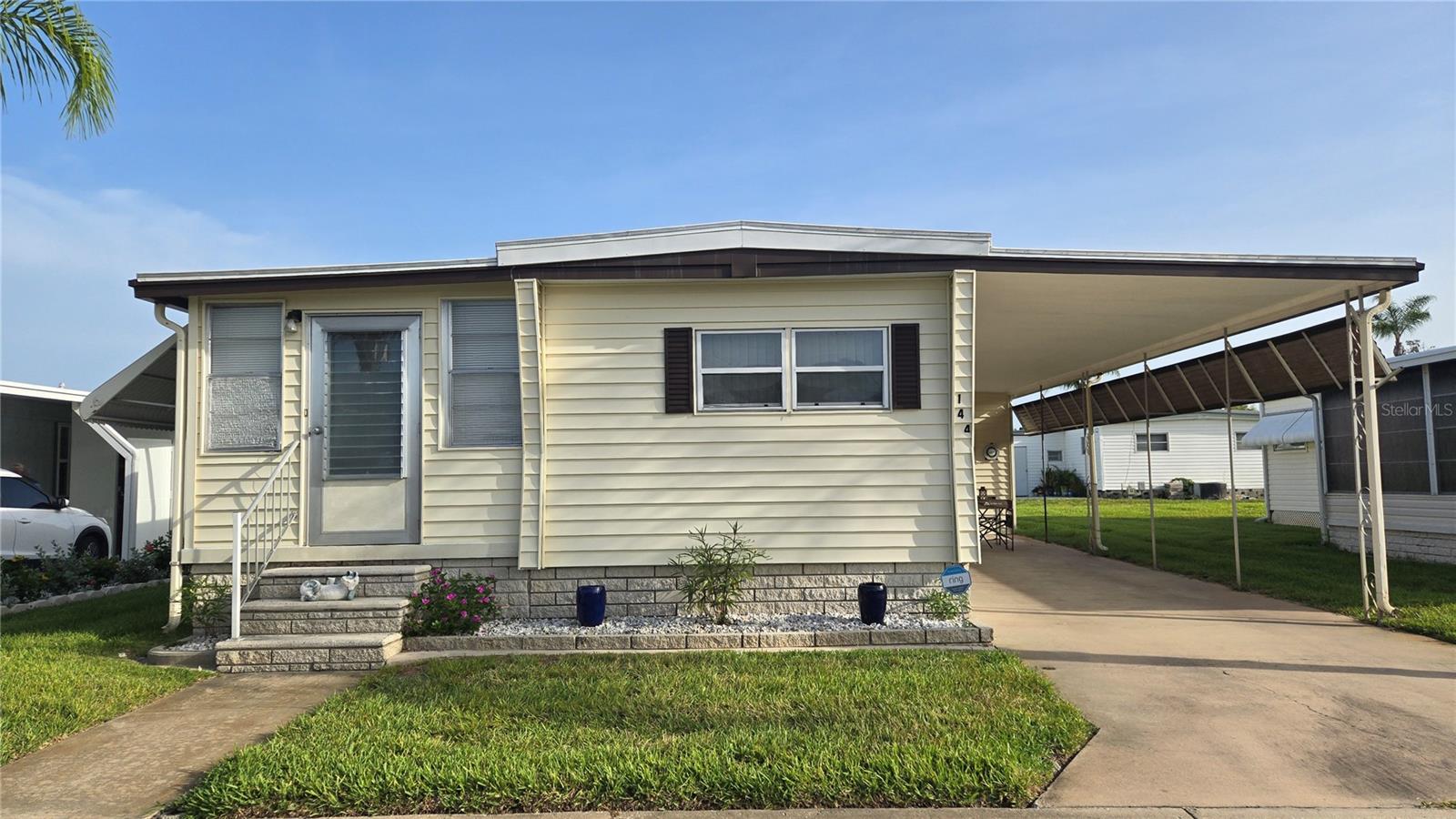 *PRICED TO SELL!** **Lots of Living Space** **Optional 3rd Bedroom** Charming & Spacious Furnished 2BR/2BA Home with Florida Room in a great location! You will love Tarpon Shores Resident Owned 55+ Community. It is warm and welcoming with many amenities, events, onsite management, and golf-cart friendly. YOU OWN A SHARE IN THE CO-OP! No LOT RENT! The $40K share price is included in the list price and can be financed through the CO-OP. This is a beautifully maintained Single-wide+ mobile home that has been thoughtfully updated offering comfort, character, and functionality throughout. The split bedroom floor plan provides privacy and flexibility, with both bedrooms featuring built-in closets and dressers for maximum storage. The second bedroom boasts its own ensuite bath complete with an updated step-in shower for guests or a private retreat. The guest bathroom features double sinks, solid surface countertops, step-in shower with grab bars, and linen storage, including a built-in hamper. Updated thermal double-pane windows (throughout the home except the Florida room and guest bath), vinyl plank flooring, and ceiling fans in both bedrooms, the living room, and the kitchen. The open living area offers built-in cabinets, a sleeper sofa, two comfy recliners, and the TV is included. There is a large formal dining room area and another built in closet. ***The Florida room is a bonus space that includes a trundle bed, dresser, and TV—easily used as a 3rd Bedroom or additional space for entertaining.*** The kitchen is updated and has plenty of cabinet space, a mobile island, and a cozy dinette area. Appliances include a Whirlpool refrigerator (2015) with icemaker, a GE microwave (2020), Range with hood and exhaust fan. ADDITIONAL FEATURES INCLUDE: New Roof Over and AC/Heat New in 2017, Bright, Beaded, white wainscot wall paneling throughout this home. This ideal, low-maintenance upgrade adds warmth, charm, and style to this beautiful mobile home. Two-car carport. Ramp access. Good sized storage shed. Vinyl siding with awnings, downspouts and gutters, sprinkler system. Offered furnished (optional) for turnkey convenience—just bring your suitcase! This single-wide PLUS home truly offers more space, thoughtful upgrades, and move-in ready comfort. THIS VIBRANT, FRIENDLY COMMUNITY OFFERS: resort-style amenities, including a large clubhouse, heated pool, BBQ grills, a fully equipped kitchen, a library, billiard room, covered shuffleboard courts, bocce ball, pickleball, horseshoe pits, and a calendar full of social activities and monthly newsletters. Enjoy affordable, MAINTENANCE-FREE LIVING WITH A LOW MONTHLY CO-OP FEE OF $315, covering lawn mowing, lawn spraying (fertilizer, insecticide, and weed control), water, sewer, trash pickup, cable TV with a park information channel, internet and Wi-Fi. No additional fees, no special assessments, and low taxes—all in a non-flood hazard zone. Nearby golfing, the Pinellas Trail, boating, shopping, fine dining, and breathtaking sunsets just minutes away. This is your chance to own a home in one of Tarpon Springs best 55+ communities. Check out the virtual tour. Don’t miss your opportunity to own this gem—schedule your showing today!