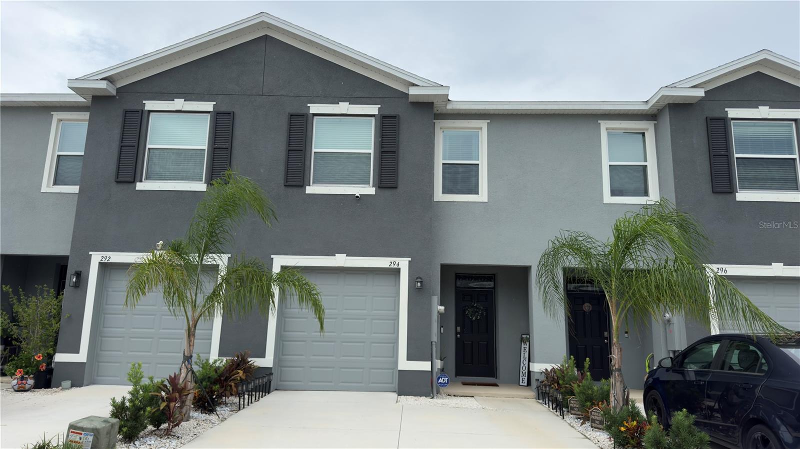 Welcome to this exceptionally well-maintained 3 bedroom, 2.5 bath townhome located in the desirable community of Mangrove Manor. Built just recently and loaded with upgrades, this home offers the perfect blend of comfort, style, and convenience. Step inside to find a bright, open-concept layout designed for modern living. The spacious kitchen features contemporary finishes, ample cabinetry, and flows seamlessly into the dining and living areas, ideal for both everyday living and entertaining. Enjoy tranquil pond views right from your living room and outdoor patio, enhanced by motorized slider blinds for effortless privacy and comfort. Upstairs, you’ll find three generously sized bedrooms, including a primary suite with a private bath and walk-in closet. Located just minutes from shopping, dining, and entertainment, this home offers both convenience and serenity.