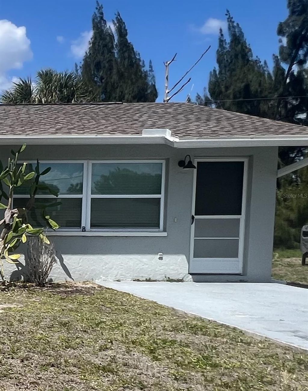 Photo of 12056 Henley Avenue #B, Port Charlotte, FL 33981 (MLS # C7523898)