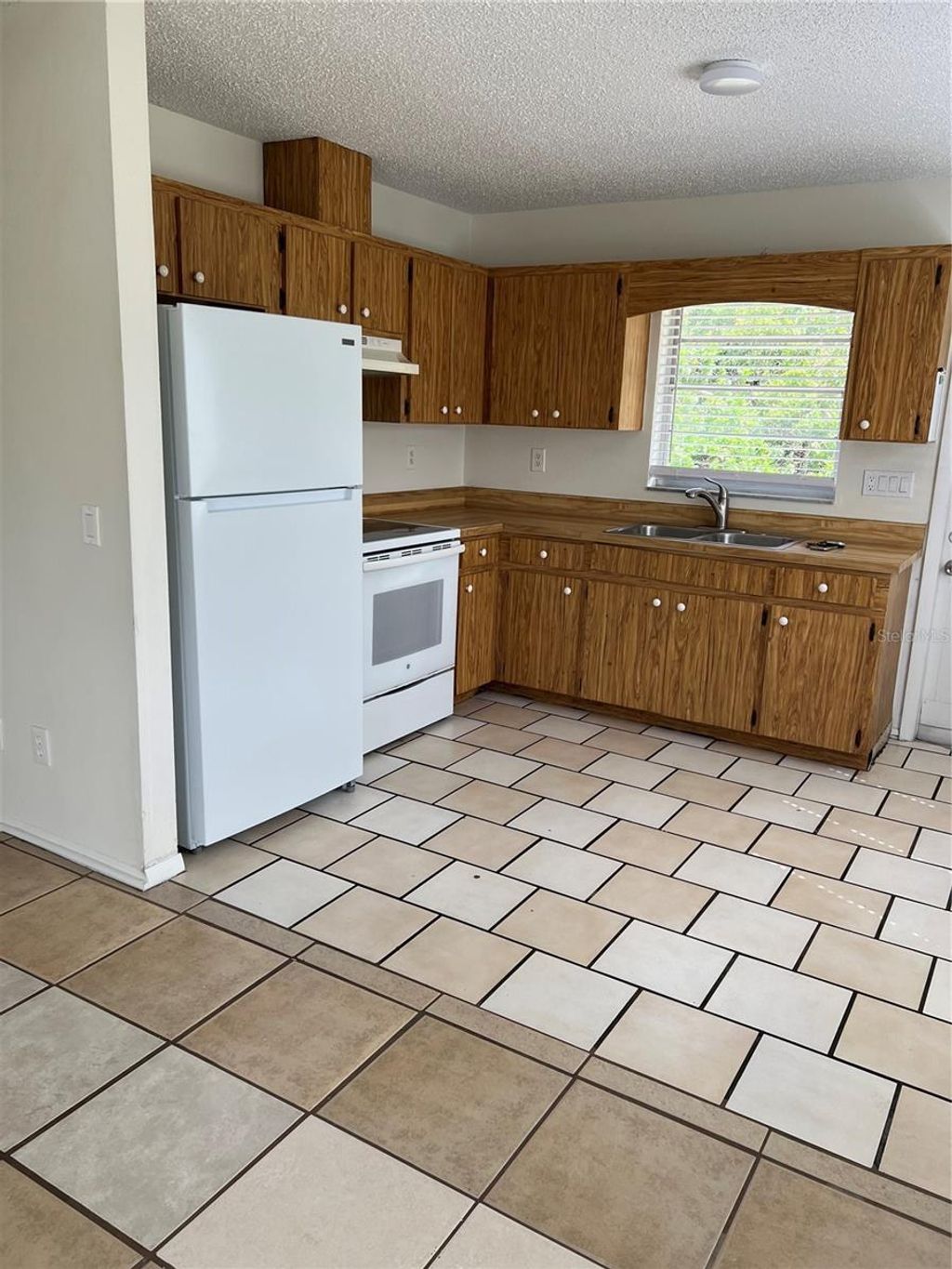 Photo of 12056 Henley Avenue #B, Port Charlotte, FL 33981 (MLS # C7523898)