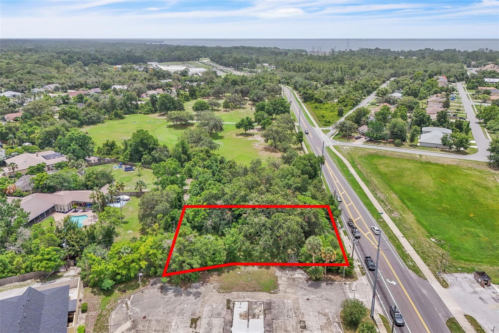Exceptional vacant land offering endless development potential with no HOA restrictions. Zoned for commercial use and ideally located in a high-visibility, high-traffic area, this cleared and level parcel presents a prime opportunity for retail, office, or mixed-use development. Surrounded by a blend of commercial and residential properties, the location is perfect for businesses looking to maximize exposure and growth. While utilities are not currently available, they are nearby, helping streamline future development. A rare investment opportunity for developers and entrepreneurs in a thriving market. Drive by and imagine the possibilities!