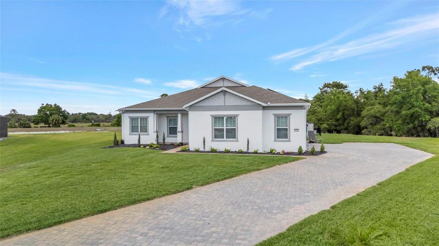 Welcome to 4708 FLAGSTAFF CT. Located in Sunset Preserve, this nearly new 2025 pool home sits on a premium cul-de-sac .61acre premium lot, a rare find in this area, delivering privacy, space, and flexibility most buyers can’t get in new construction. With over 3,000 sq ft, this home features 4 bedrooms, 3 full baths, and a dedicated office, ideal for remote work or flex space. The open-concept layout is built for real living, with seamless flow, clean sightlines, and abundant natural light, all anchored by ceramic tile flooring throughout for a clean, low-maintenance finish.
The kitchen is a true centerpiece, featuring quartz countertops, custom cabinetry with glass upper cabinets, backsplash, built-in oven and microwave, cooktop, wine cooler, high-end stainless appliances, custom island pendant lighting, and a fully customized pantry with built-in shelving. The dining room is elevated with a custom chandelier, while the living room impresses with a coffered ceiling, surround sound, custom ceiling fan, and a three-pane sliding glass door opening directly to the pool.
High-end finishes carry throughout the home, including crown molding, tall baseboards, and custom lighting that elevate the overall feel well beyond builder grade.
The primary suite is privately positioned with French door entry and a tray ceiling, while the home’s entry makes a strong first impression with dual tray ceilings.
Step outside to a fully finished private pool with paver deck, sun shelf, and water features, all enclosed with frameless screen panels designed to maximize unobstructed views. The backyard is one of the standout features, backing directly to conservation with no rear neighbors and beautiful views toward the lake, delivering the privacy buyers are actively searching for. The space is already pre-plumbed and pre-wired for an outdoor kitchen, and the lot offers true usable land for expanded outdoor living.
Additional highlights include an oversized, expanded 3-car side-entry garage with EV charging, HVAC system with built-in UV air purification, pre-plumbing for a water softener, and low HOA. The home has a private well used to irrigate the grounds.
Homes like this, nearly an acre, private pool, cul-de-sac location, no rear neighbors, conservation and lake views, and a dedicated office—don’t come up often. Sunset Preserve is a gated estate community offering half-acre+ and lakefront homesites with private boat ramp access to Lake Pickett, plus a lakefront pavilion and playground. Located just minutes from 417 & 408, you get fast access across Orlando with shopping, dining, and entertainment nearby at Waterford Lakes Town Center, Waterford Towers, Oviedo Mall, and East Colonial Drive.