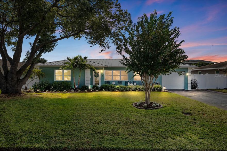 Welcome to your gorgeous three bedroom two and a half bath pool home, located just minutes from downtown St. Petersburg and the Gulf Beaches. This property has been meticulously maintained, located on a quiet street and features so many upgrades, it's hard to list them all! The open floor plan is wonderful for entertaining, with a chef's kitchen and an oversized granite breakfast island a perfect place for a buffet. The split-level floor plan, with its newly finished owner's bath, provides a tranquil oasis away from the other bedrooms and living areas. The owner's bath also includes a soaking tub, an oversized shower with a rain shower head and a walk-in closet. Impact windows and sun tunnels bring plenty of natural light into the house, particularly in the family room, which receives the morning sun a wonderful place to enjoy a cup of coffee to start the day. The custom pool was refinished to emulate the color of the water in St. John, Virgin Islands. Don't forget about the covered patio with beautiful pavers that surround the entire pool area. The backyard was designed and landscaped to create a resort-like feel around the pool. In addition to a gorgeous backyard, there is a detached flex suite with a split AC system, ideal for working from home or for playtime. Other special features include Impact windows and doors, new metal roof, security system, water softener, irrigation well pump, and a private pool bath entrance. All of this is just minutes from the best restaurants, world-class beaches and museums. Come and enjoy Florida living at its finest!