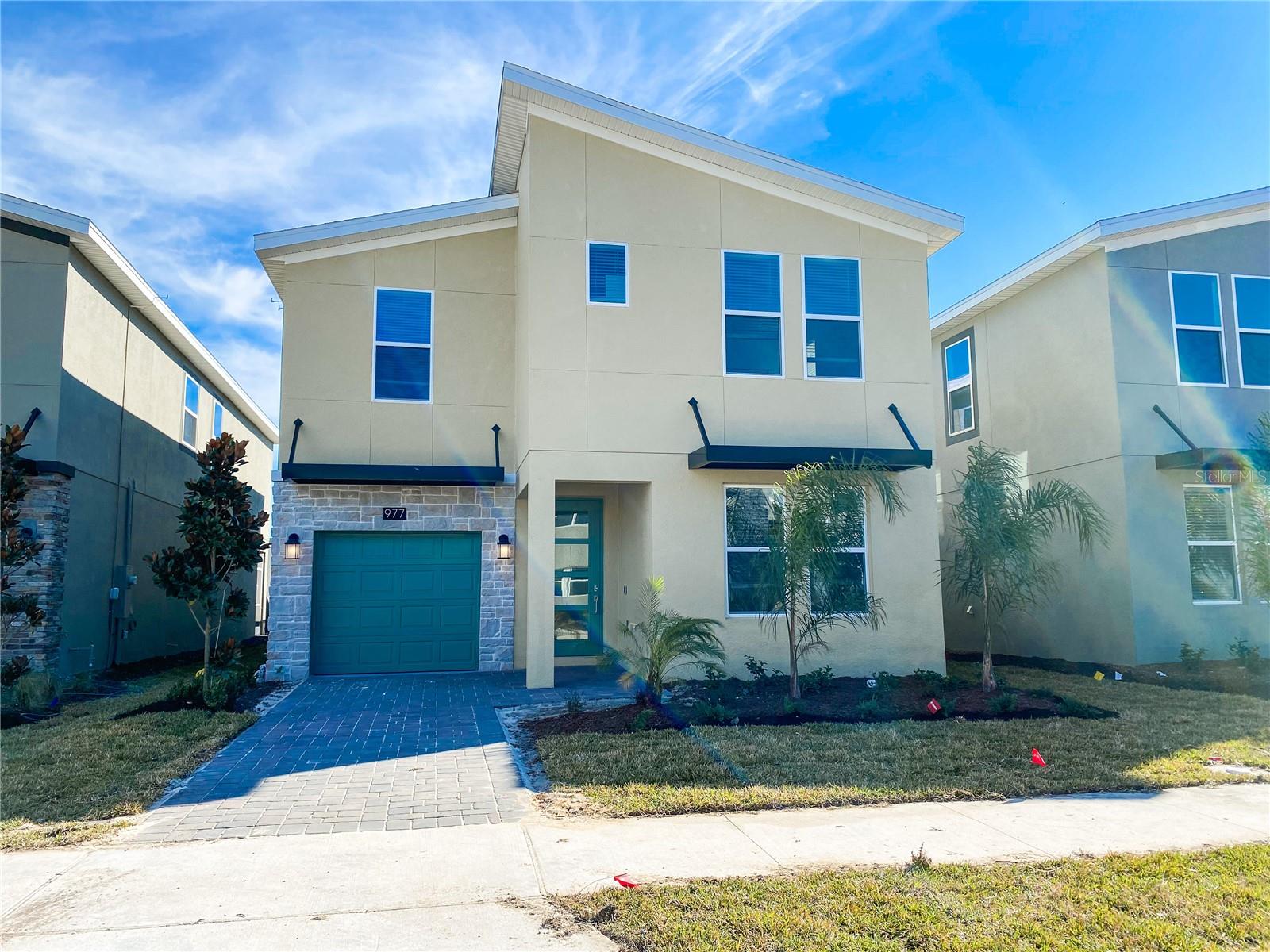 Resort-style living in ChampionsGate! This modern and spacious two-story home, built in 2021, is located in the highly desirable ChampionsGate Resort and features 6 bedrooms, 5 bathrooms, a flexible loft space, and a screened-in private pool—perfect for relaxing or entertaining. The layout includes one guest suite downstairs, with five additional bedrooms upstairs, including two primary suites, ideal for extended family or guests. washer and dryer are in place. Rent includes pool and lawn maintenance, basic cable and internet, and daily trash pickup. Residents enjoy access to an upscale clubhouse, resort-style pool, lazy river, splash pad, fitness center, game room, movie theater, restaurant with two full bars, private cabanas, and more. Conveniently located near top-rated schools, shopping, dining, and just minutes from Disney and other major attractions. Easy to show—contact us today to schedule a tour!