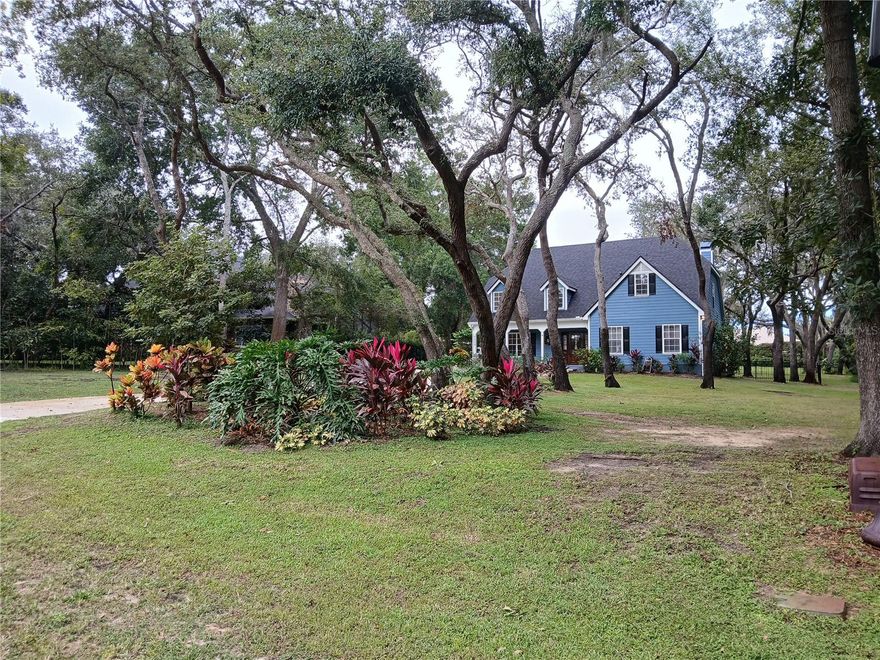 The hidden gem of Clermont... Off Lakeshore drive... Gorgeous Oaks subdivision, all by itself at end. Lake louisa access, dock, ramp.. playground in community, tennis court. Beautiful wooded lot. 2 story, detached grg w/extra rm upstairs (plumbing downstairs for bath). Partially fenced by. Downstairs laundry room, kitchen looking in to large living rm, dinnett at end of kitchen. Half bath.  Mst bedroom & another bedroom. Upstairs 2 more bedrooms, bath. Since owner bought, replumbed hse, new roof on hse & det grg, removed carpet, put laminate wood, new water system, some new irrigation, new blk iron fence, painted inside & out, took out popcorn ceiling, new hot water htr, new drain field, $15k in tree work, $18k in concrete d/way. Wow! All has made it so nice. Almost 3/4 ac