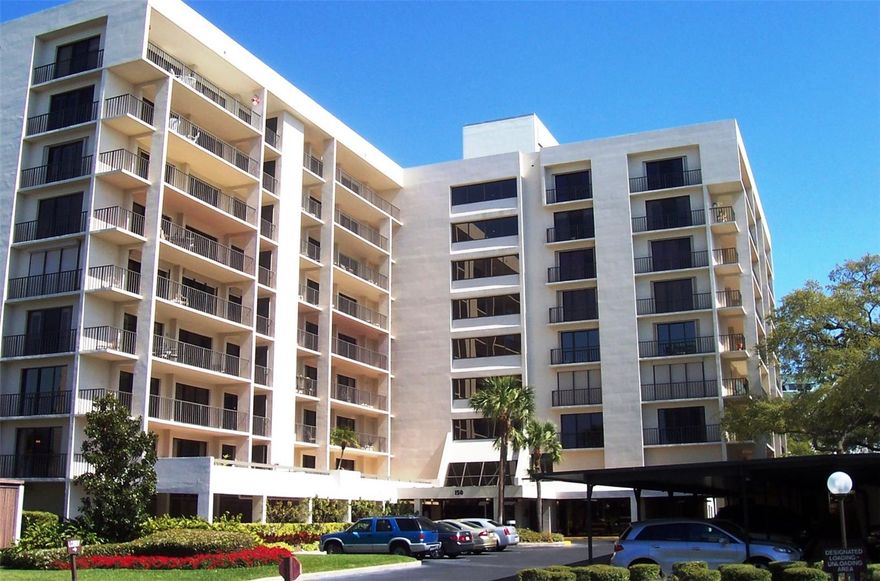 Enjoy the quiet luxury of the gated community.  of The Belleair Country Cub.  24-hour security at the gate as well as secure entry.  This spacious two bedroom, two bath condominium features two large living area spacious eat in kitchen, a primary bedroom with en-suite bath, plenty of closet space, laundry room off the kitchen large balcony with access from both bedrooms.  And best of all stunning water views. 
Hardwood, laminate and tile floors, New AC. Storage unit and covered parking close to the front door.  All ages welcome. Enjoy the heated pool and beautiful grounds for walking or biking. Golf,country club and gym available for extra fee. More pictures coming.