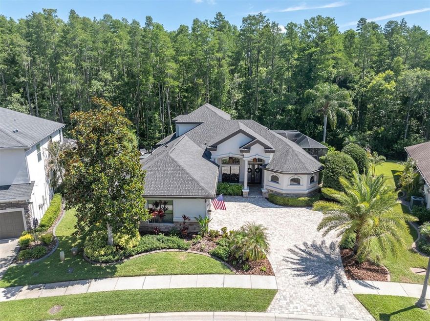 Located in the highly sought-after gated and manned community of Grey Hawk in prime Odessa, this beautifully upgraded home offers luxury living with privacy, modern conveniences, and access to top-rated schools including J.W. Mitchell High School. Residents enjoy exceptional community amenities including a fishing pier, playground, tennis courts, and scenic surroundings.
Inside, this spacious 4-bedroom home features an upstairs bonus area complete with a theater room and game/rec space, perfect for entertaining or relaxing with family and friends. Elegant interior details include tray ceilings, crown molding, and a stunning gas fireplace with cultured stone accents that creates a warm and inviting focal point in the living area. The kitchen is equipped with a gas range and stainless steel appliances, ideal for both everyday living and entertaining. The home also boasts numerous modern updates including renovated bathrooms, a stylish updated half bath near the upstairs movie room, new carpet upstairs, and upgraded SPF Coretec Cairo Oak flooring downstairs. The laundry room has been refreshed with new tile and sink, while custom plantation shutters downstairs and solar-tinted front windows add both elegance and efficiency. New fans and lighting throughout the home create a bright, modern feel, and dual AC systems equipped with HVAC ultraviolet light air purifiers provide enhanced indoor comfort.
The garage has been thoughtfully upgraded with a new epoxy floor, insulated garage doors, mini-split AC system, overhead storage racks, a 220-volt EV charging outlet, new water softener (2024), and tankless water heater.
Situated on a private conservation lot, the exterior is designed for both relaxation and entertaining. Recent improvements include a newer roof (2023), fresh exterior paint (2023), updated exterior lighting (2025), and a painted deck that enhances the home’s curb appeal. The backyard oasis features a PebbleTec saltwater pool and spa heated by either propane or the newer electric heater (2024), a screened pool cage, black metal fencing, and lush mature landscaping with palm trees, mango and lime trees. Additional outdoor highlights include a turf dog run, rubber mulch side yard, and a smart Rachio sprinkler system.
This smart-enabled home also includes Nest door cameras, MyQ garage door openers, My Leviton pool cage lighting, and an OmniLogic automated pool system for seamless control and convenience.
Location is ideal from easy commute to Tampa Airport and downtown! This is a hidden gem in the Odessa community.
