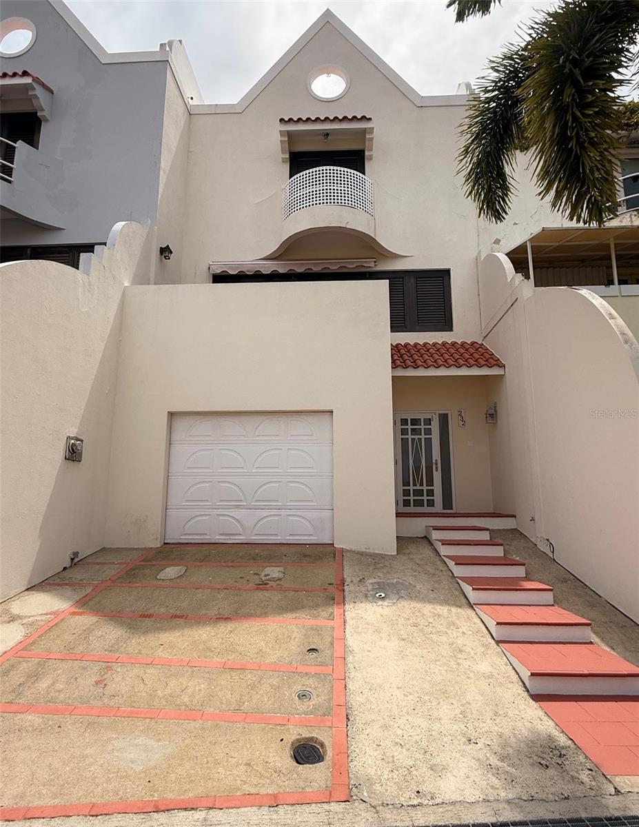Residence available for long-term rental in Palmas del Mar a beach resort community consisting of a country club, golf courses, tennis, a beach club, residences and a hotel. It is located in the municipality of Humacao, Puerto Rico, on the southeast corner of the island.
The rental price includes maintenance of the pool and air conditioning units.
This spacious property is spread across three levels plus a terrace or sundeck with distant ocean views.
The residence features a foyer, a garage for one vehicle, and additional space to park two more cars in front of the house. The first level offers open-concept areas including a balcony, living room, dining area, kitchen, and direct access to the pool. The second floor includes three comfortable bedrooms and a laundry area, while the upper level features the rooftop terrace."