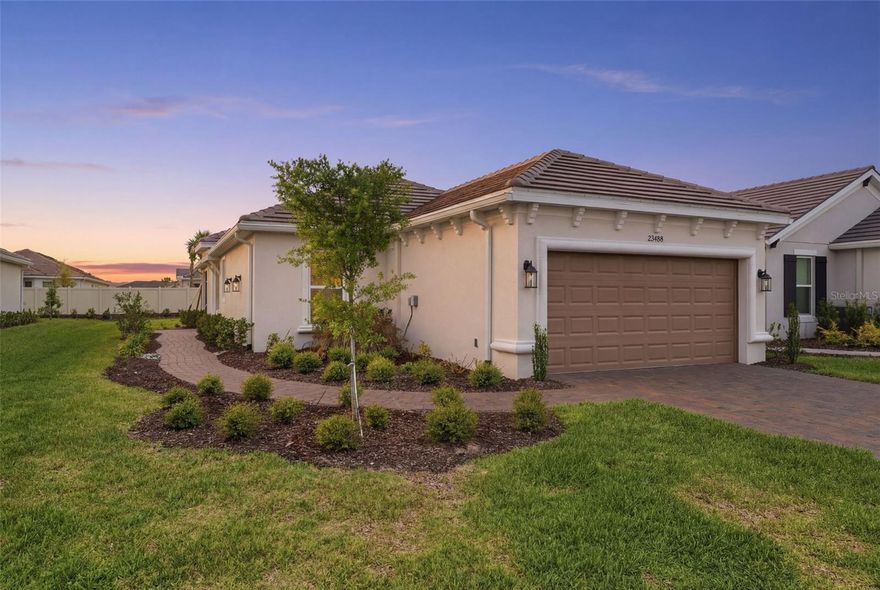 Welcome to refined, maintenance-free living in the highly sought-after, gated 55+ community of Esplanade at Wiregrass Ranch! This beautifully upgraded Roma floorplan offers 2 bedrooms, 2 full baths, and a versatile den/flex space designed to fit your lifestyle. Built with care at the design center, this home showcases tasteful, high-end upgrades throughout. Enjoy tile flooring in every room—no carpet—complemented by elegant tray ceilings and crown molding that add a touch of sophistication. The den features pocket doors, providing privacy for a home office or guest space. The open-concept kitchen is perfect for everyday living and entertaining, featuring a gas range and access to a gas community, which also includes a tankless gas water heater and an optional gas dryer connection. The laundry room is thoughtfully equipped with both upper and lower cabinetry for added convenience. Relax and unwind in the spacious primary suite, complete with a frameless glass shower enclosure for a spa-like feel. Step outside to the screened lanai, where you can enjoy peaceful outdoor living, with recently sealed pavers enhancing both beauty and durability. For added peace of mind, this home includes a BRAND NEW WHOLE-HOUSE GENERATOR—a rare and valuable upgrade. Residents of Esplanade at Wiregrass Ranch enjoy world-class amenities modeled after the Ritz-Carlton lifestyle, including a luxury spa, demonstration kitchen, resort-style pool, state-of-the-art fitness center, pickleball and tennis courts, scenic walking trails, and an on-site café. All of this is conveniently located near hospitals, shopping, dining, entertainment, and with easy access to the airport. Experience the perfect blend of luxury, comfort, and community in one of the area’s most sought-after active adult neighborhoods.