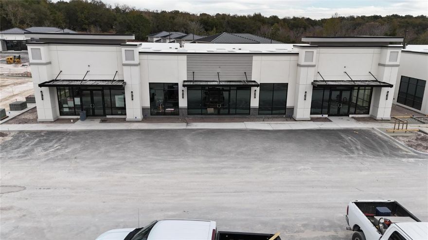 Under Construction. Building #03 is available for purchase at Lake Carter Exchange, a distinguished mixed-use development in Apopka’s East Shore at the intersection of Ocoee-Apopka Road and W Keene Road. This dark gray shell retail building features a customizable interior, shared patio space and end-unit dedicated patio space. The shell delivery provides buyers with maximum flexibility to design the interior layout, with three front entrances supporting up to three unique suites. The development is strategically located less than one mile from Advent Health’s seven-story, 120-bed hospital and opposite a new Publix Supermarket development. Situated in the vibrant East Shore trade area, which includes 5,000 planned residences and an average household income above $100k, this Class A property is perfectly positioned for businesses targeting growth in Central Florida’s second-fastest-growing city. Contact us for pricing details/incentives and to schedule a tour of this exceptional commercial opportunity.