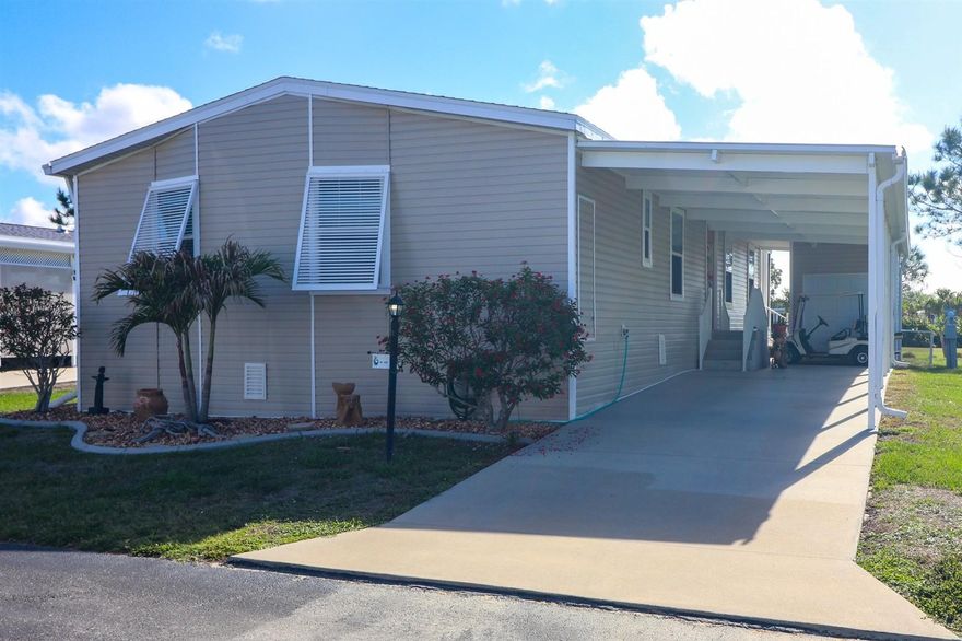 Whether it's Golf or Active LifeStyle Blue Heron Pines 55+ Community is for YOU! at 29200 Jones Loop Rd #715, Punta Gorda, Florida 33950. This 2016 Skyline Two BedRoom Two Bath Plus Bonus Den/Office/Family Room is Approx. 1350 sq.ft. Plus 10x20 Screened Enclosed Deck with a View of the 17th Hole at BHP Executive Course. Un-Furnished, BUT! Golf Cart is Negotiable! And a Golf Cart Garage to keep it Dry w/Extra Storage Too! UpDates: Roof-Shingle 2023. Two Car Carport to Front Enters Foyer with Picture Display Alcove. Oak Pecan color Planking Thru the Home. Open Concept Vaulted Ceilings in LivingRoom with Planter's Shelving & Blinds. Cream color Bullnose Drywall. DiningRoom with Ceiling Fans. Kitchen with wrap around Island / Breakfast Bar Seating & Storage. Kitchen appliances: French Door Bottom Freezer w/Ice & Water/ Dishwasher/Dual Stainless Steel Sinks w/Disposal/ Flat Range w/Hood Microwave. Metal Trivet Back Splash. Upper Cabinets Expresso in color. Bonus Room Inside Laundry Washer&Dryer Included in Sale. Additional Storage in Laundry Room Plus Linen Cabinets. Entire Home has WIDE wheelchair Doors & Hall. Guest Bath Tub/Shower Combo. 2nd Bonus Room currently a Den/Office with French Door. Primary BedRoom w/ Barn Door Walk-In Closet. Master Bath has Handi-Rails in Shower. Dual Vanities & Privy Alcove. Have your Morning Coffee or your Evening Social Hour on your back Enclosed Screened Deck Overlooking Mature Landscaping! Call Today for Your Tour!