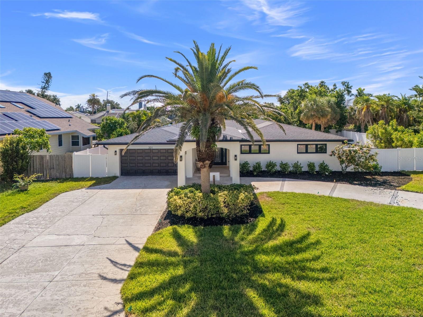Imagine waking up to the gentle rustle of palm fronds, golden sunlight streaming through hurricane-impact glass, and the inviting sparkle of your private pool just steps away. Nestled within the exclusive Monte Cristo enclave of Tierra Verde, this completely reimagined 4-bedroom, 3-bathroom, 2700 square foot estate is more than a home—it’s your private coastal sanctuary. Set on a rare oversized one-third-acre lot, mornings begin with coffee on the poolside terrace, while evenings invite a glass of wine beneath a canopy of stars, the spa’s soothing bubbles dancing in rhythm with the Gulf breeze. A large circular driveway and elegant porte cochere welcome you home in style, framed by lush new landscaping, fresh stucco, and a flawless exterior paint finish—setting the tone for the meticulous craftsmanship found throughout. Inside, every detail whispers brand new. Raised ceilings in the living and dining areas create an airy sophistication, while an open floor plan flows seamlessly into the home’s showpiece kitchen. Here, Taj Mahal quartz countertops cascade over a stunning waterfall island, complemented by custom cabinetry, a wrapped quartz hood vent, and a walk-in pantry designed for effortless entertaining. The living area centers around a dramatic TV wall with custom storage, floating shelves, and a cozy fireplace—perfect for gatherings large or small. A brand-new roof crowns the home, while all-new hurricane-impact windows, sliders, and doors provide peace of mind and timeless style. Every surface has been renewed, with all-new drywall, electrical, and plumbing. A new vinyl privacy fence encloses the backyard oasis, where new sod and a full irrigation system keep the grounds lush year-round. The spacious master suite is a retreat unto itself, with private pool access, dual walk-in closets, and a spa-like bath. A dedicated home office—complete with glass double doors and private backyard access—offers a serene space to work or study. Additional enhancements include a brand-new HVAC system, water heater and garage door. The addition of a brand new mudroom with custom cabinetry and laundry allows for modern comfort and storage. Beyond beauty, this home offers unmatched security and resilience: it has never flooded and sustained no hurricane damage during last year’s two major storms. In Monte Cristo, where modern luxury meets the florida coastal dream, you’re just minutes from award-winning beaches, marinas, fine dining, and the vibrant coastal lifestyle that makes Tierra Verde one of Florida’s most desirable destinations. Yet with a home like this, you may find the best part of Florida is already waiting in your own backyard.