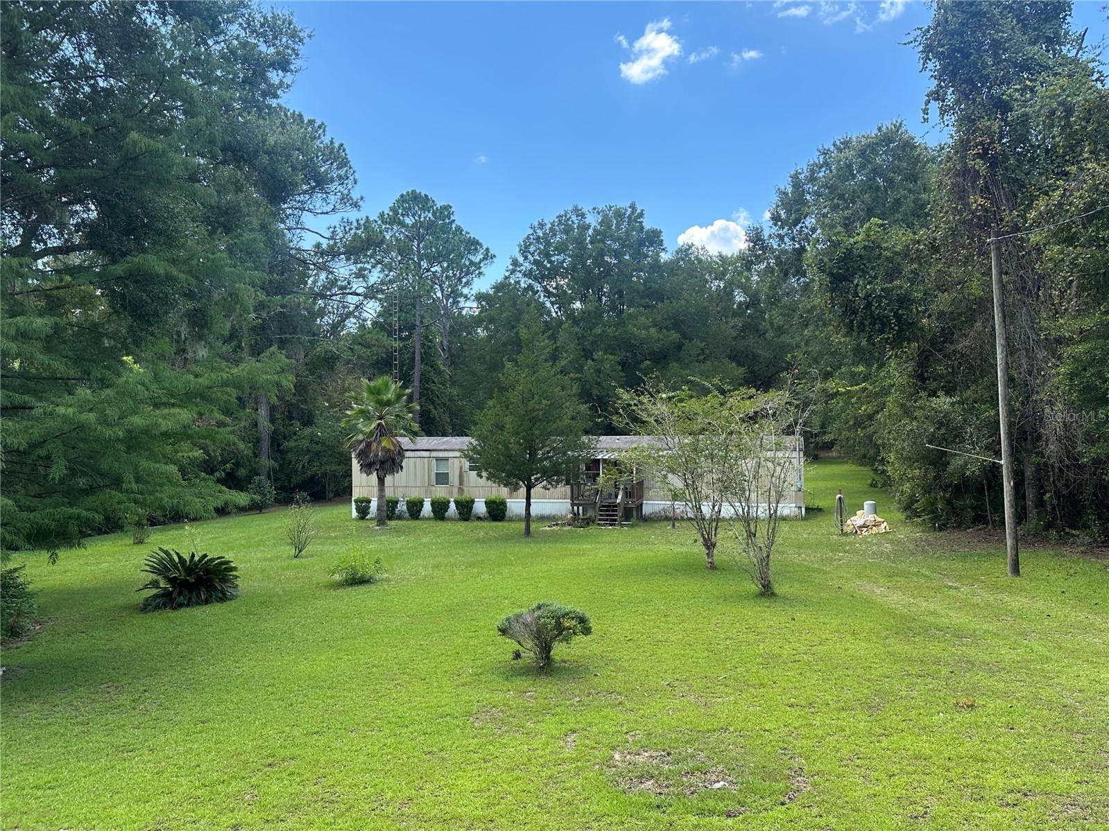 A rare INVESTMENT FIND in Westwood Acres North, Ocala!! This manufactured home built in 1993 sits on a spacious 1.04-acre lot nestled in a quiet neighborhood, this home offers TREMENDOUS potential for investors, flippers, or savvy owner-occupants ready to roll up their sleeves. -- Featuring 3 bedrooms and 2 bathrooms with approximately 1,088 sq ft of living space, it’s the perfect canvas to revitalize into a cozy primary residence or a rental property. -- Zoned General Agriculture-A1. -- HVAC: 2020 -- Approximately 12 miles from the World Equestrian Center!! -- Set up your private showing TODAY!!