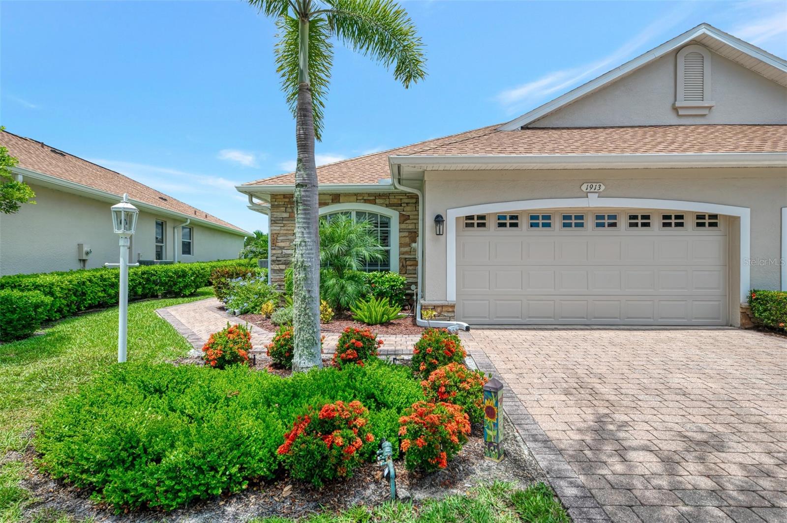ACT FAST!! This picturesque Villa features an open, split floor plan. 2 bedrooms, 2 bath plus a den/office with Murphy bed/desk used as a 3rd bedroom/office and attached 2 car garage. Luxury Plank Vinyl Flooring installed throughout September 2022. New water heater 2024. This is a rare opportunity to own an attached home in the coveted community of The Carriage Homes of Lakeside Plantation. This bright and cheery villa has a wonderful kitchen with island that overlooks the dining and living area. It has Stainless Steel appliances added September 2022 Including Refrigerator, electric stove with air fryer oven, microwave, dishwasher and disposal! Light cabinets add brightness to the area! French doors open to a spacious lanai with an inviting view to a community lake. A gorgeous master suite with 2 walk-in closets. Waterfront view from living area and Master suite. Utility closet houses washer/dryer added September 2022! Gutters all the way around updated in 2023 and new GAF roof with vents put on July 2023! Exterior painted late 2023! Electrical updates with surge protector done May 2023! Air conditioner installed 2018 with new compressor installed May 2025! Updated blinds added at all windows and doors in 2024! This is in a HOA community with access to enjoy 2 POOLS! A private heated pool and cabana are just steps away. Neighbors and friends gather here all seasons. The motto of The Carriage Homes, "Forever Friends Made in Paradise". When in the mood for more activities, around the corner is the Lakeside Plantation Clubhouse, heated pool, spa, exercise room, courts, a park with grill and tables. There is even a playground. Lakeside Plantation is a CDD community. The fees are included in your taxes. Close to beaches (over 11 reachable in 45 minutes or less), fine dining, shopping, easy access to airports and I-75, lots of close attractions, great schools and much more accentuate this home! Call for an appointment!