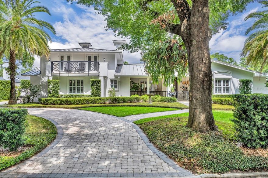 Now offered at $2,495,000—an outstanding value for a thoughtfully designed pool home on a spacious lot in Winter Park’s most sought after neighborhoods. Located in the heart of the “Golden Triangle”—the core residential district just a short walk from Park Avenue’s world-class shopping and dining—940 Lincoln Circle is a beautifully renovated West Indies/Key West-style home that blends architectural charm, comfortable elegance, and thoughtful functionality on an oversized .33-acre lot. With 4 bedrooms and 4.5 bathrooms across 3,551 square feet, this home lives primarily as a one-story layout, enhanced by a private upstairs suite with bedroom, full bath, and bonus room—accessible from both inside and a separate outdoor entry. Ideal for multigenerational living, guests, or private work/living quarters, this flexible plan is rarely available in such a prime location. A gated front porch and covered entry open into the foyer and an expansive formal living room with vaulted wood-paneled ceilings and gas fireplace. The space flows easily into the dining area and kitchen, which overlook the screened porch and backyard oasis. The kitchen is appointed with marble countertops, custom cabinetry, gas cooktop, cabinet-paneled Sub-Zero refrigerator/freezer, double ovens, and a walk-in pantry. A custom wine room—perfect for entertaining—sits just off the main living space. A nearby den (or optional fourth bedroom with closet) is paired with a bright enclosed Florida room currently used as a home office with rose garden views. This wing connects to a full bath and a secondary bedroom at the front of the home. A stylish powder bath is conveniently tucked away for guests. The private primary suite is positioned at the rear of the property and features a soft entry, dual custom closets, outdoor access, and a beautifully appointed bathroom with dual vanities, glass-enclosed shower, soaking tub, and private water closet. Upstairs, a second guest suite with bonus/flex room and full bath is ideal for visitors, a gym, or studio. At the rear of the home, a welcoming family room with fireplace opens to the covered lanai and kitchen, offering ideal indoor-outdoor flow. The backyard is a fully fenced retreat with lush landscaping, renovated saltwater pool with new equipment, and mature trees surrounding multiple hardscape patios and garden paths. A well-appointed full bathroom with exterior access off the screened patio offers convenient functionality for pool use, gardening, or even dog washing—enhancing the home’s seamless indoor-outdoor lifestyle. The outdoor kitchen includes a Blaze grill, Fire Magic refrigerator, Blackstone griddle, stainless sink, storage cabinetry, and vent hood—creating a true resort-style environment. The oversized two-car garage features epoxy floors, built-in storage, and space for larger vehicles. Additional highlights include two Rinnai tankless water heaters, 2024 Trane condenser, 2019 Mitsubishi mini-split, full-house Generac generator with transfer switch, motorized shades by The Shade Store, and a well-appointed laundry room with built-in cabinetry, utility sink, and yard access. A rare opportunity in Winter Park’s most walkable and desirable neighborhood.
