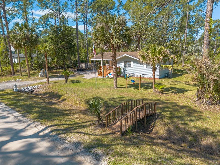 Set on a half-acre just outside the city limits of DeLand, this property offers the kind of room that’s getting harder to find. Space, flexibility, and a location that keeps you close to it all. The detached two-car garage brings serious value for storage, projects, or workspace, while the attached one-car carport adds everyday convenience.

Inside, the home is clean and functional with an updated kitchen featuring granite countertops and a fully remodeled bathroom. Well and septic keep utility costs simple with only an electric bill, and the county-maintained road adds peace of mind, all with easy access to shopping, dining, and everything DeLand has nearby. Shown by appointment only. Buyer to verify all measurements, zoning, and property details.